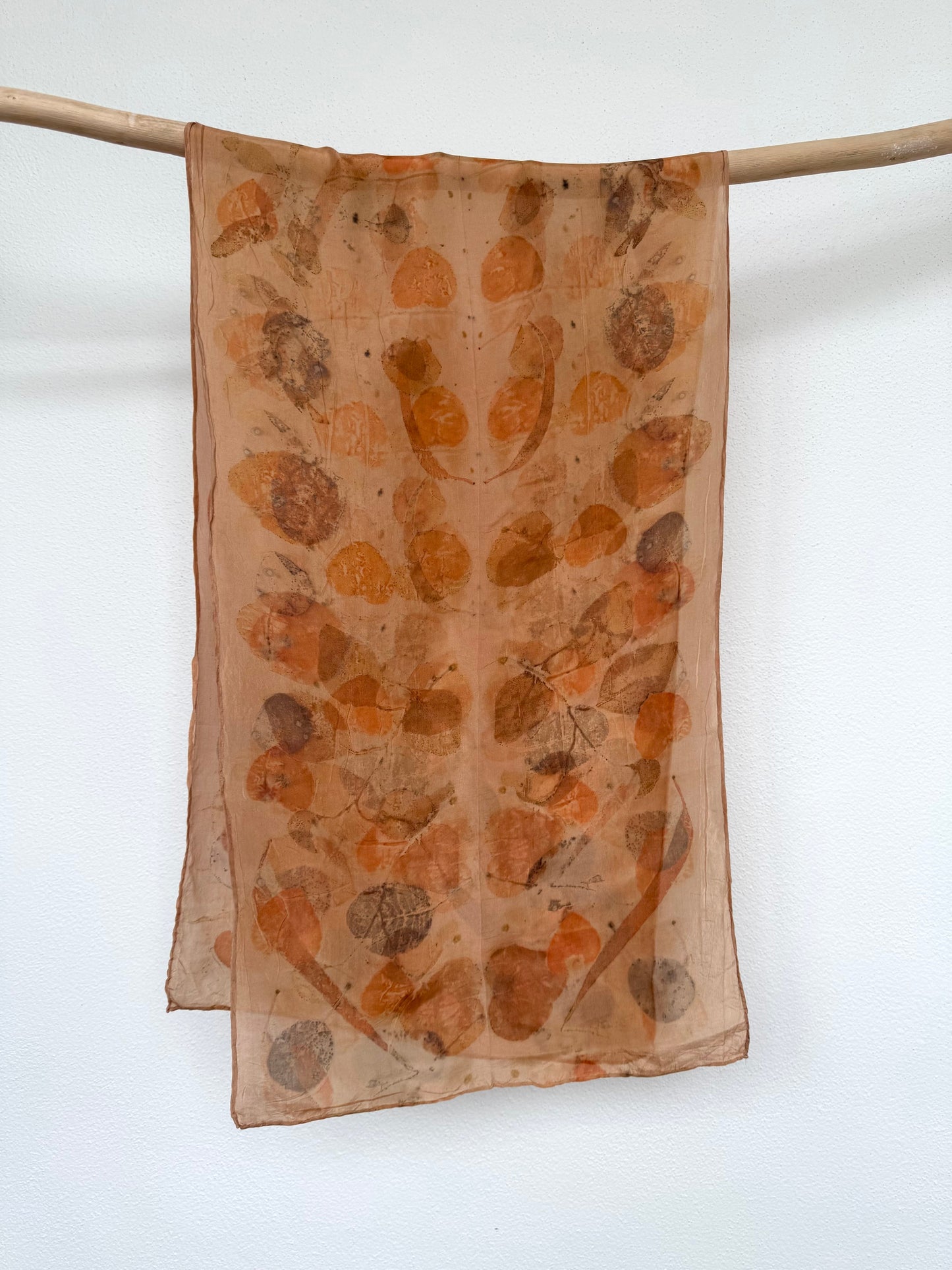 orange naturally dyed silk scarf with eucalyptus eco-print pattern by DOT 'N' POT