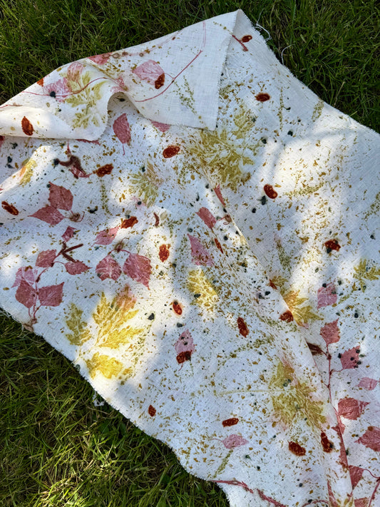 Floral-patterned, eco-printed hemp fabric on grass