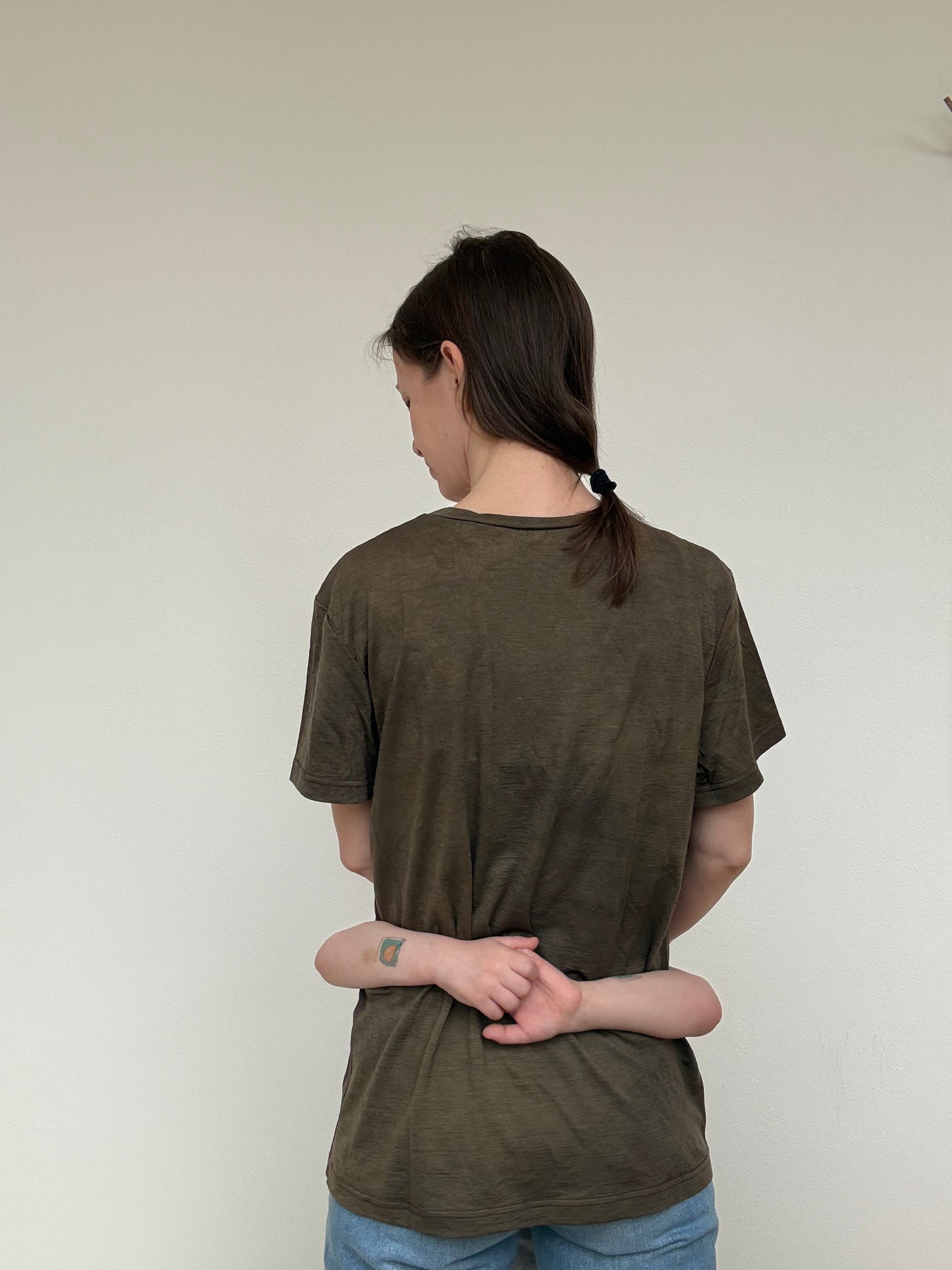 women wearing a sweet chsetnut naturally dyed merino shirt - back part