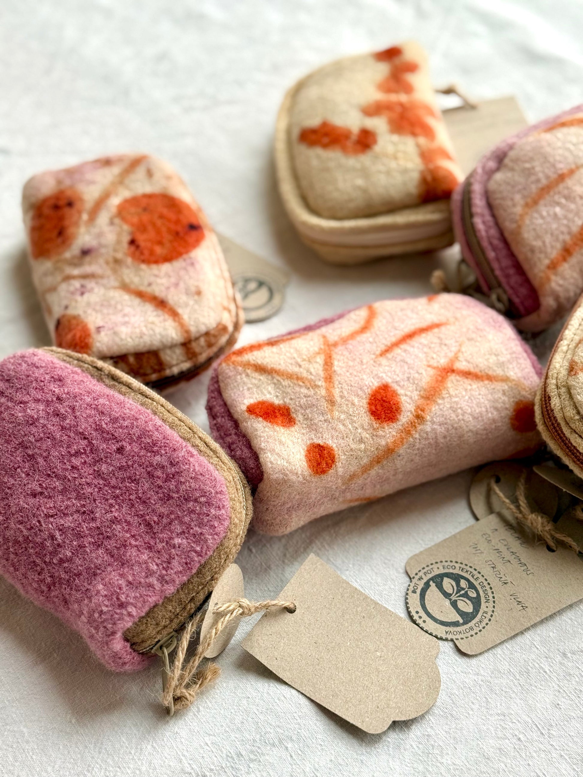 details of woolen purses naturally dyed with lac and walnut, eco-printed with eucalyptus leaves