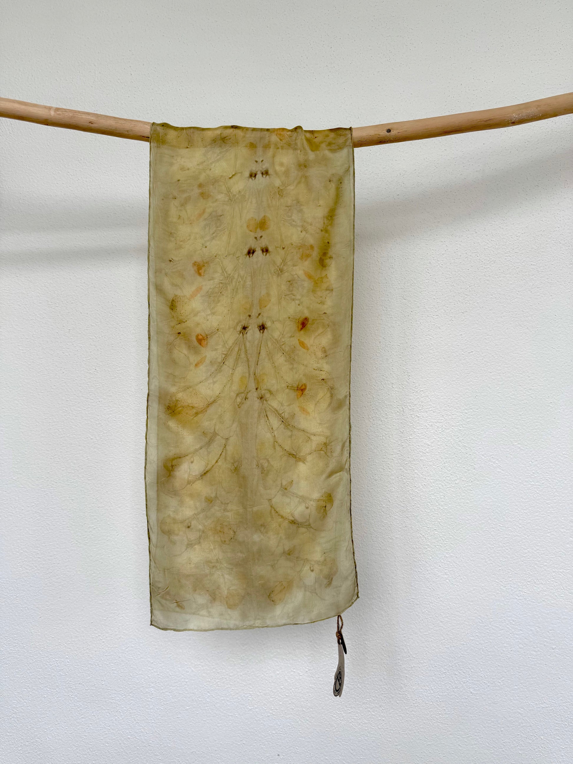 silk scarf naturally dyed with goldenrod flowers and eco-printed with eucalyptus leaves by DOT 'N' POT