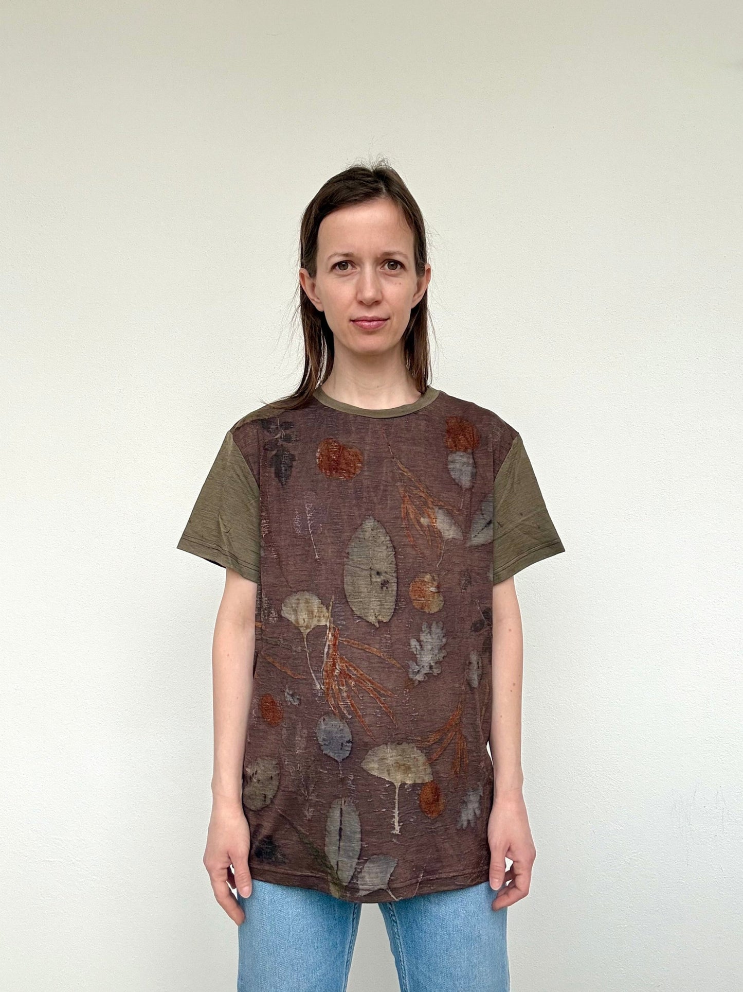 women standing in an eco-printed eucalyptus walnut merino wool t-shirt
