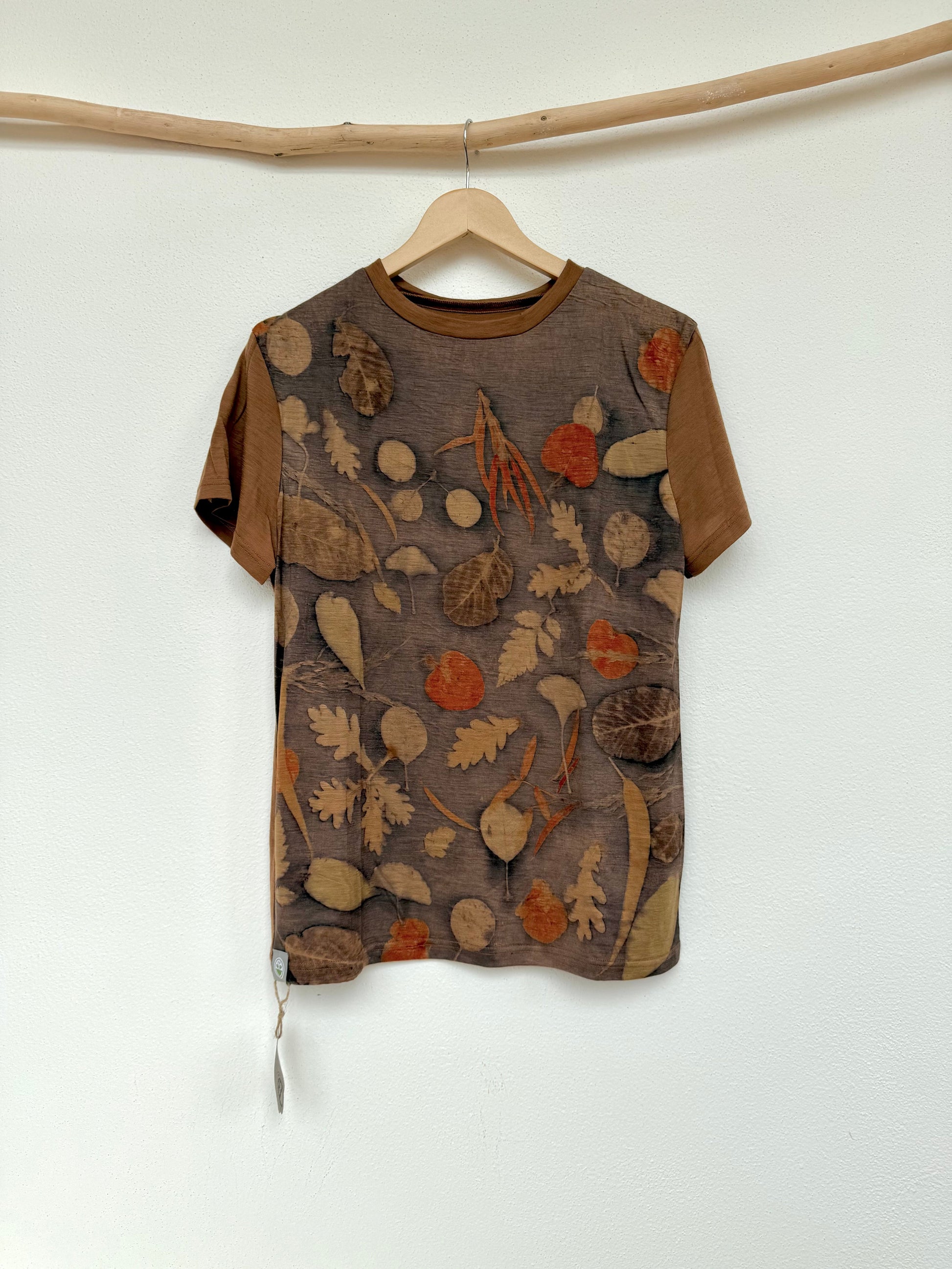Naturally dyed with walnut husks, eco-printed with various leaves like eucalyptus - a merino wool t-shirt by DOT 'N' POT