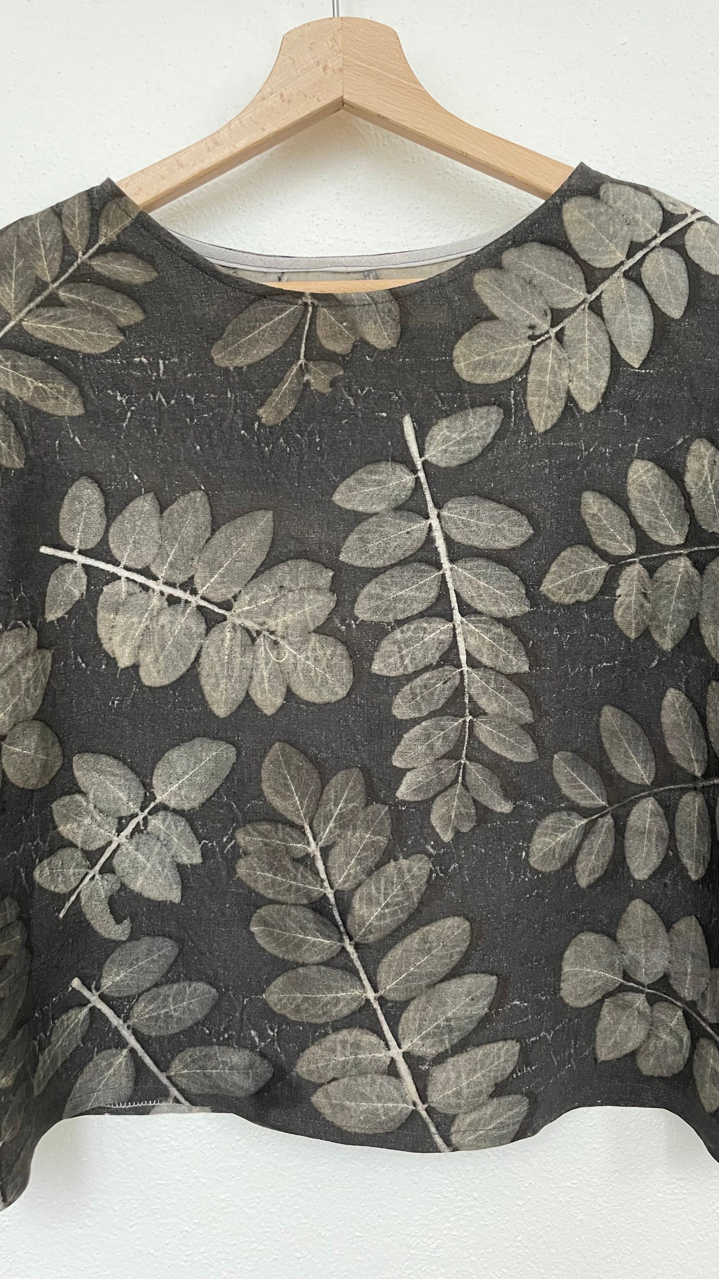 linen boxy top with eco-printed robinia leaves - front close-up with neckline