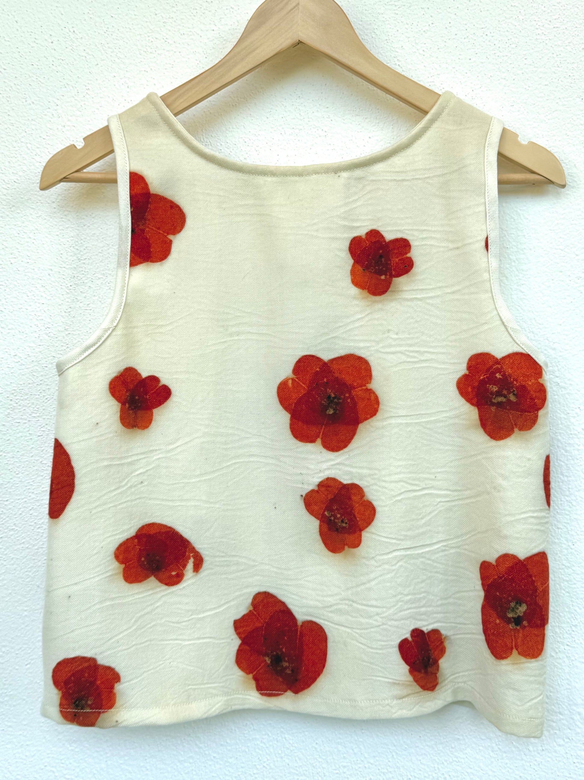 back of a eucalyptus eco-printed merino wool tank top with poppy patterns by DOT 'N' POT