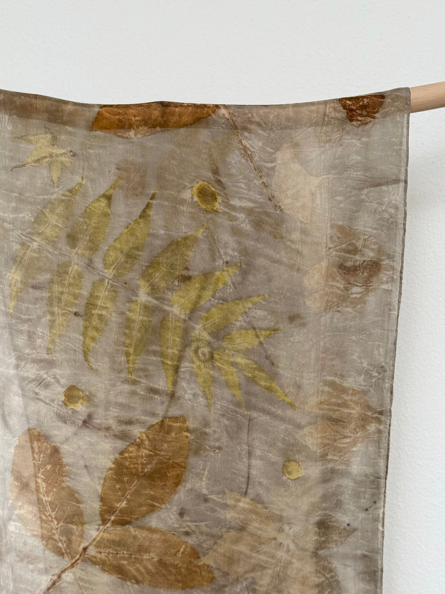 dyer's chamomile. sumac and walnut eco-print on a silk scarf 