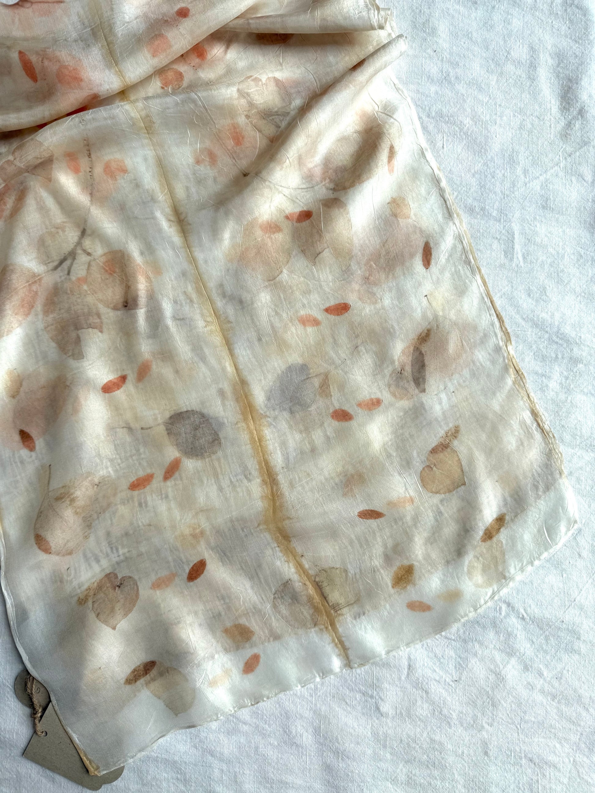 silk scarf with natural eco-print made with eucalyptus on white background