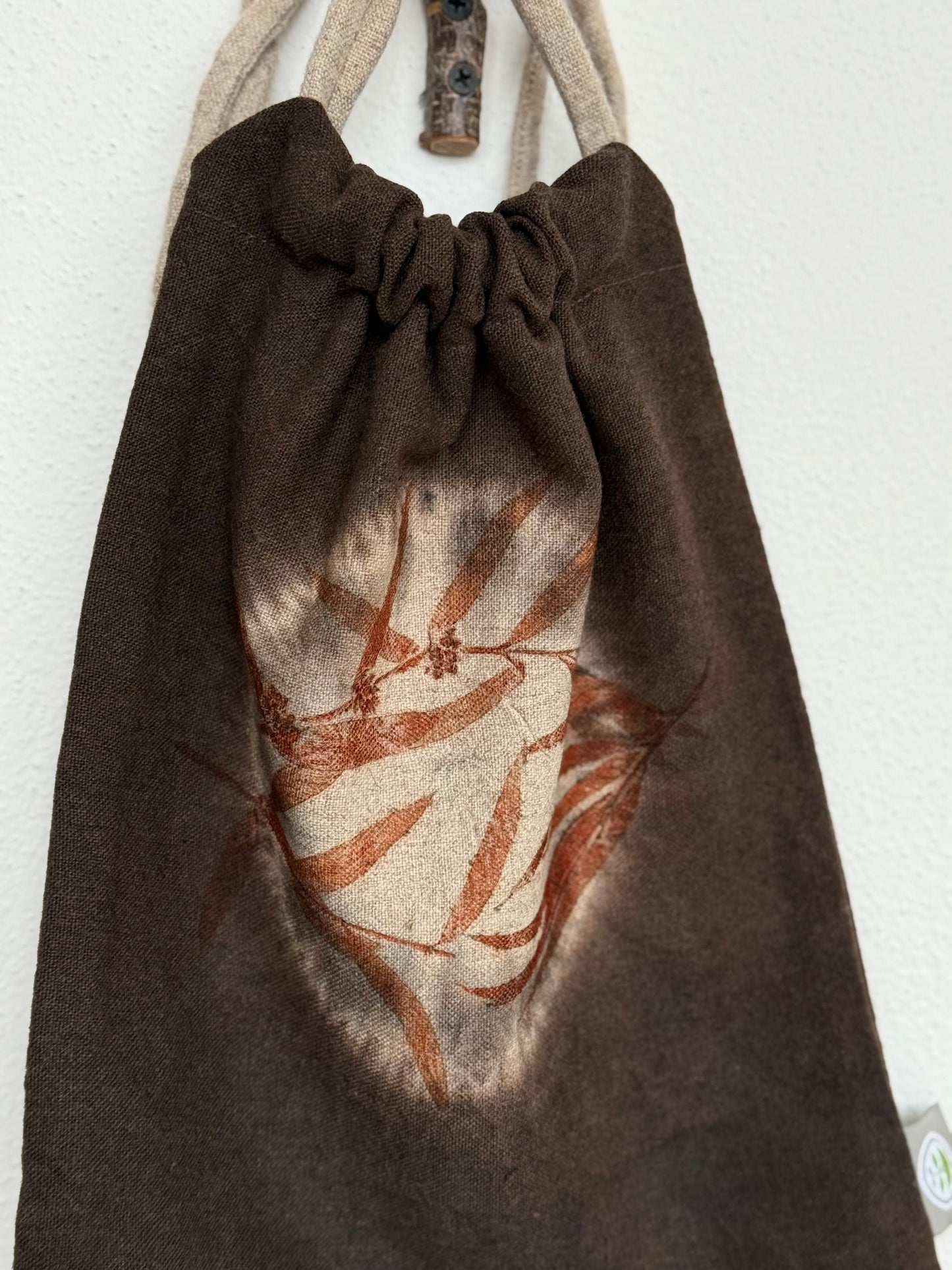 drawstring bag detail of front part - shibori, eucalyptus and dark brown background by DOT 'N' POT