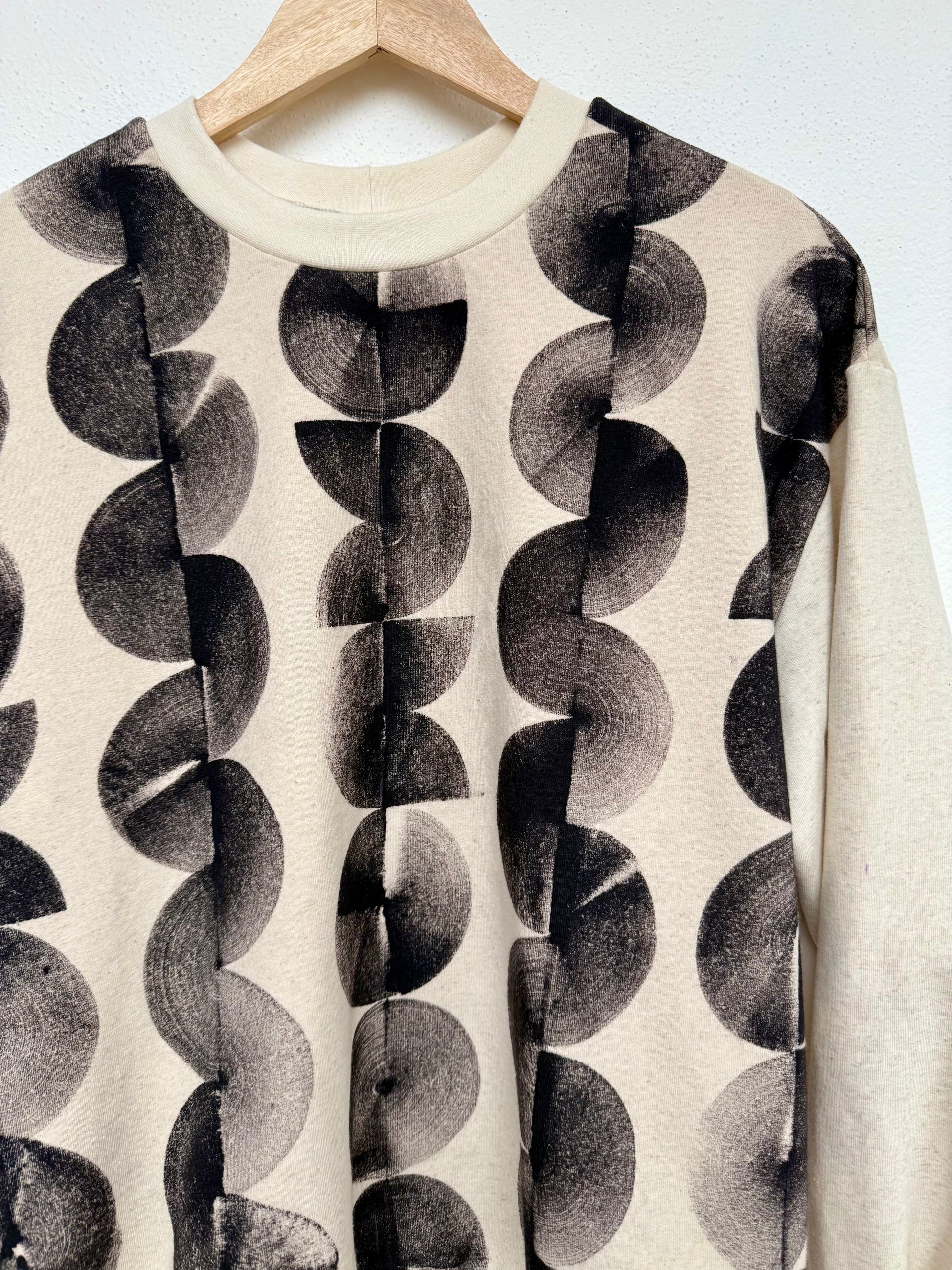 Hand-painted sweater close-up of front part with neckline in natural black 