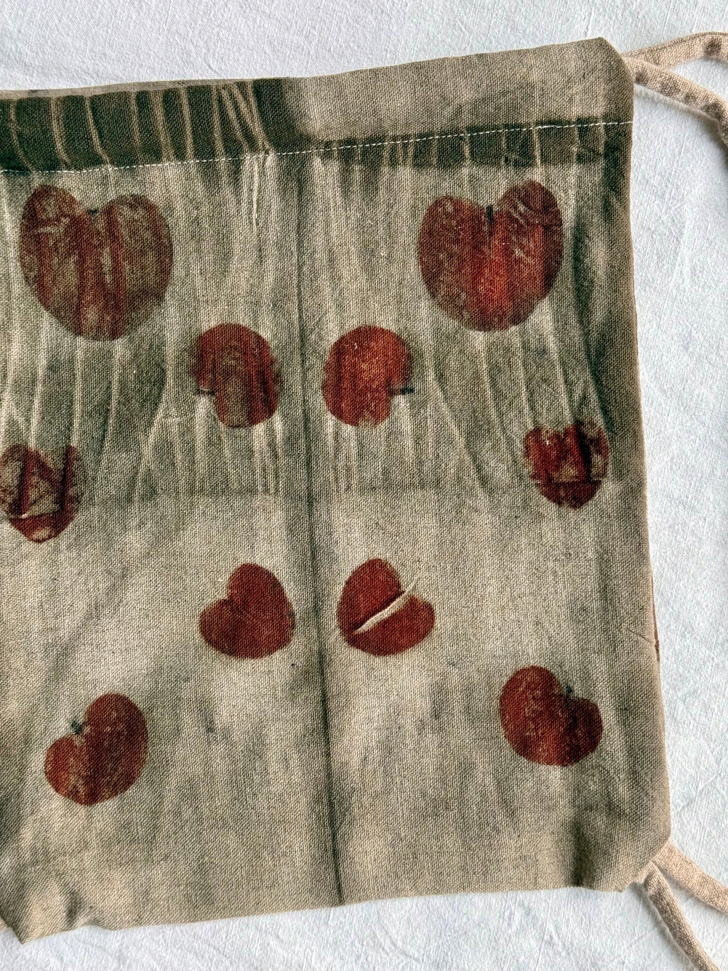 back part with eucalyptus leaves eco-printed on a bag with tie marks