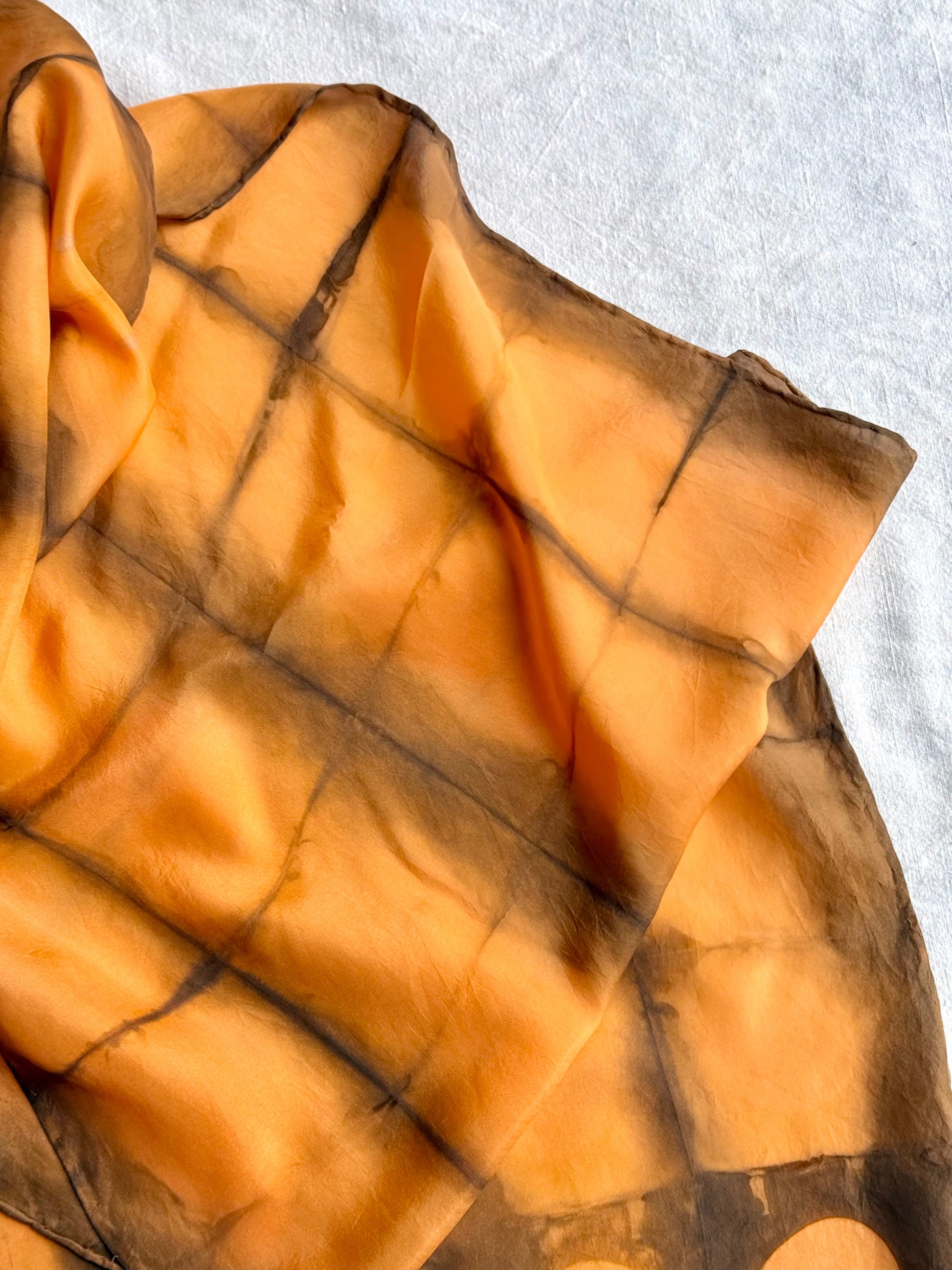 square shibori silk scarf naturally dyed with annatto seeds and sweet chestnut leaves