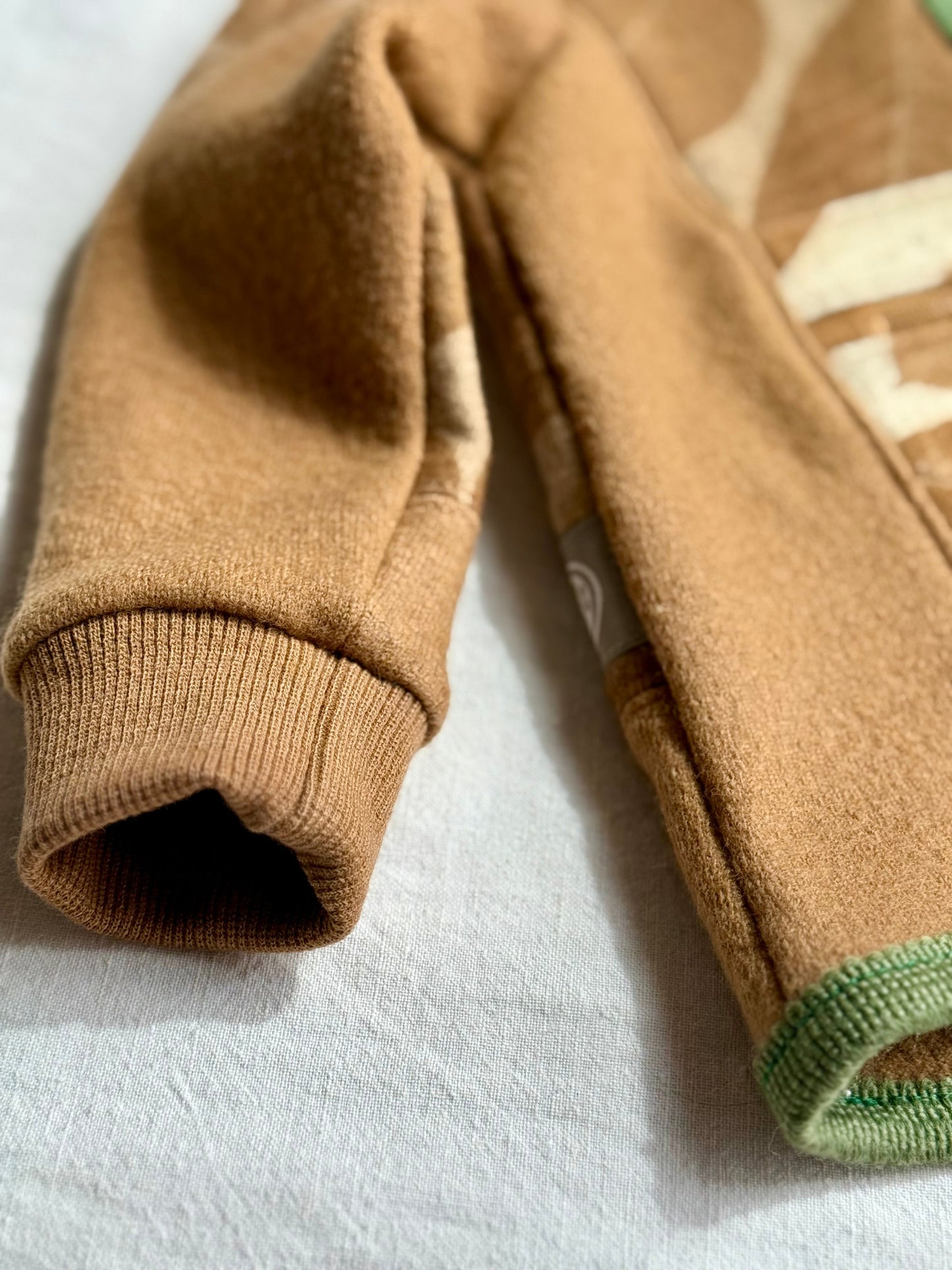 walnut dyed kids hoodie - close-up of the sleeve cuff