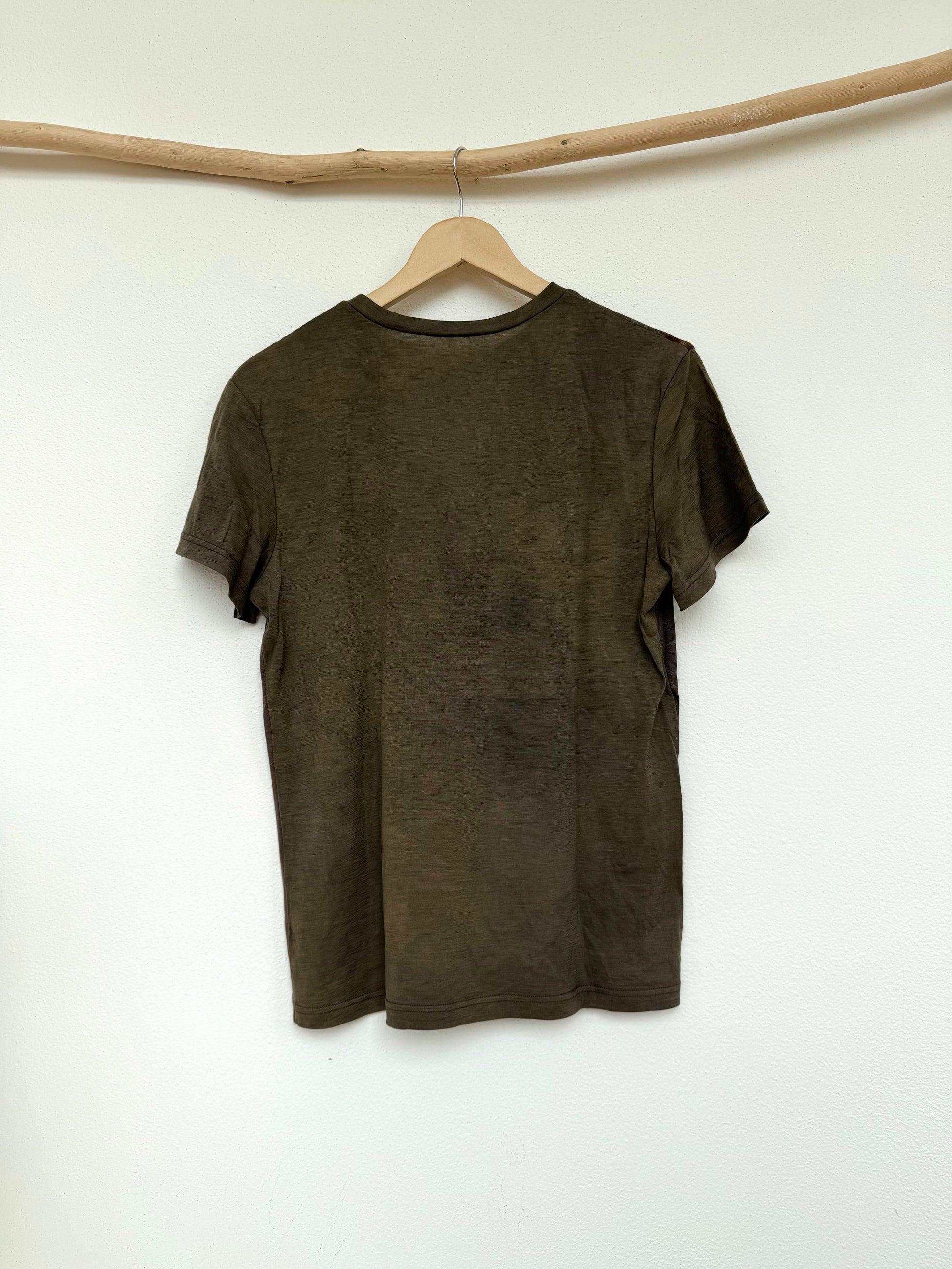 back part of a naturally gray-green dyed merino wool t-shirt 