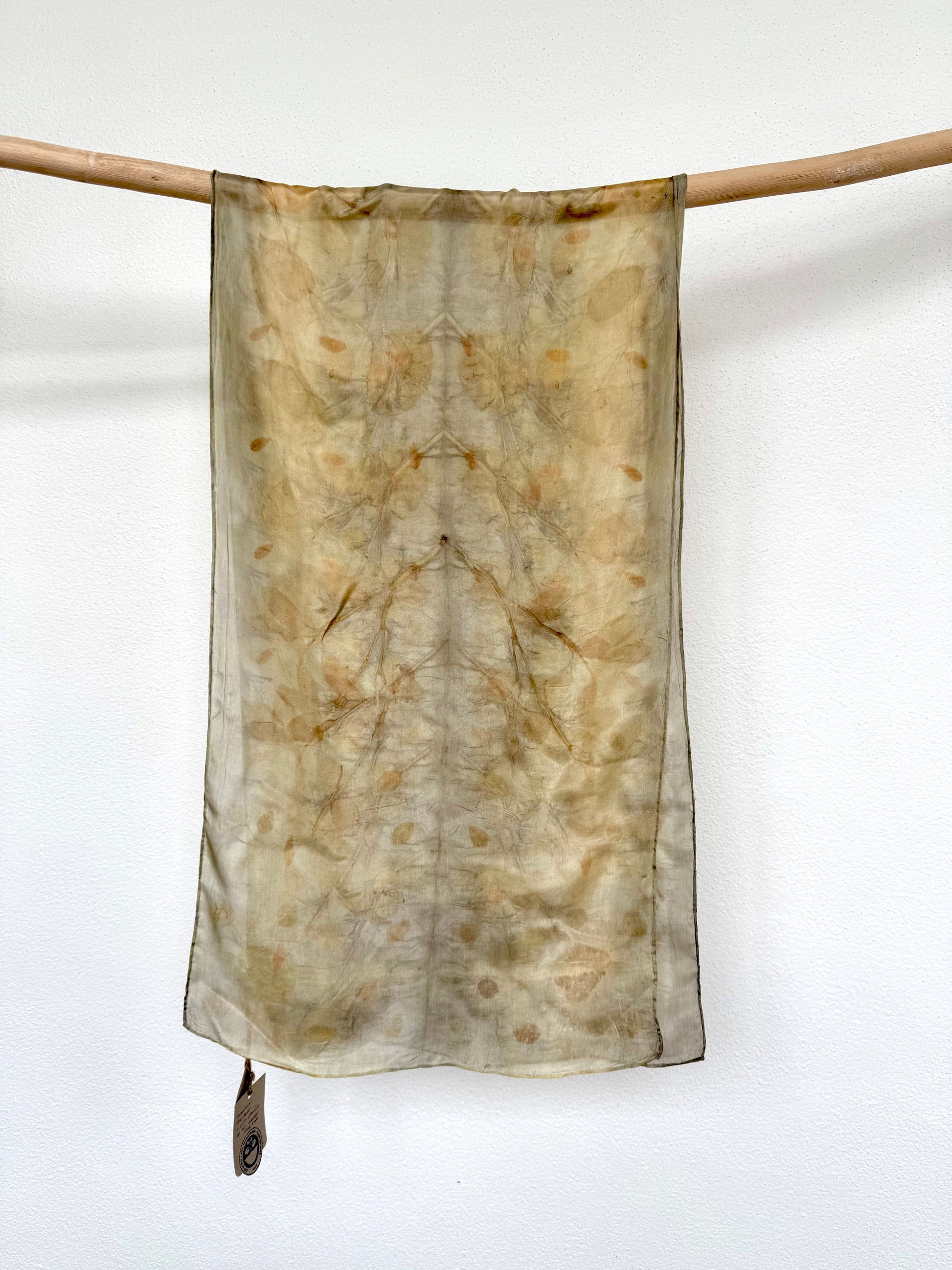 naturally dyed silk scarf with blackberry leaves and eucalyptus leaves, against a white background by DOT 'N' POT