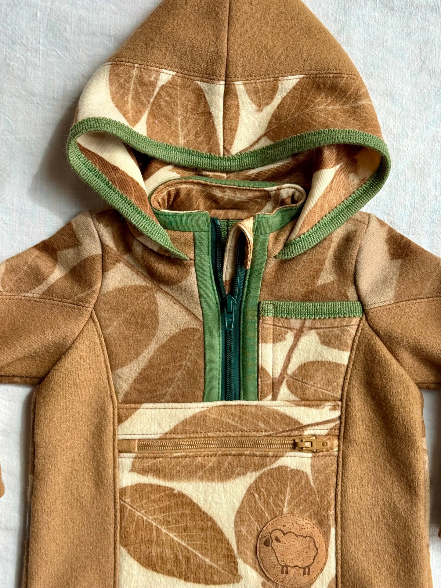 Children's hoodie with eco-printed leaf pattern, green zipper and natural brown walnut colour by DOT 'N' POT