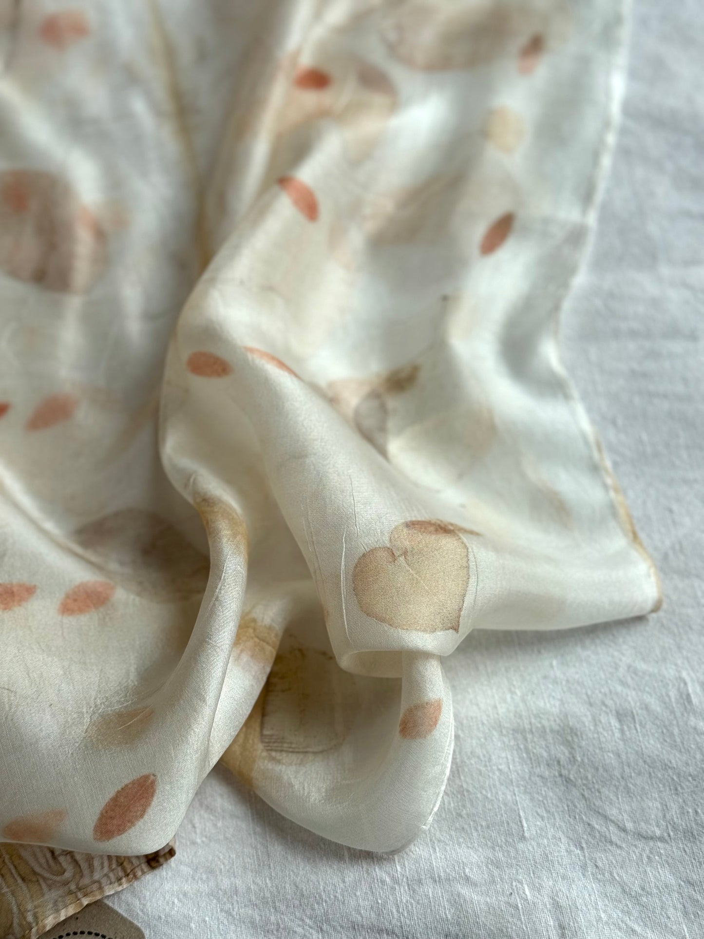 silk scarf with natural eco-print made with eucalyptus  - close-up of a heart shaped leaf
