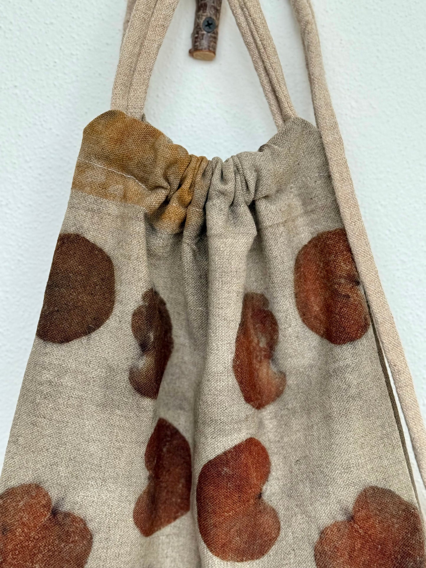 texture of woolen drawstring bag, naturally dyed - gray, brown, orange