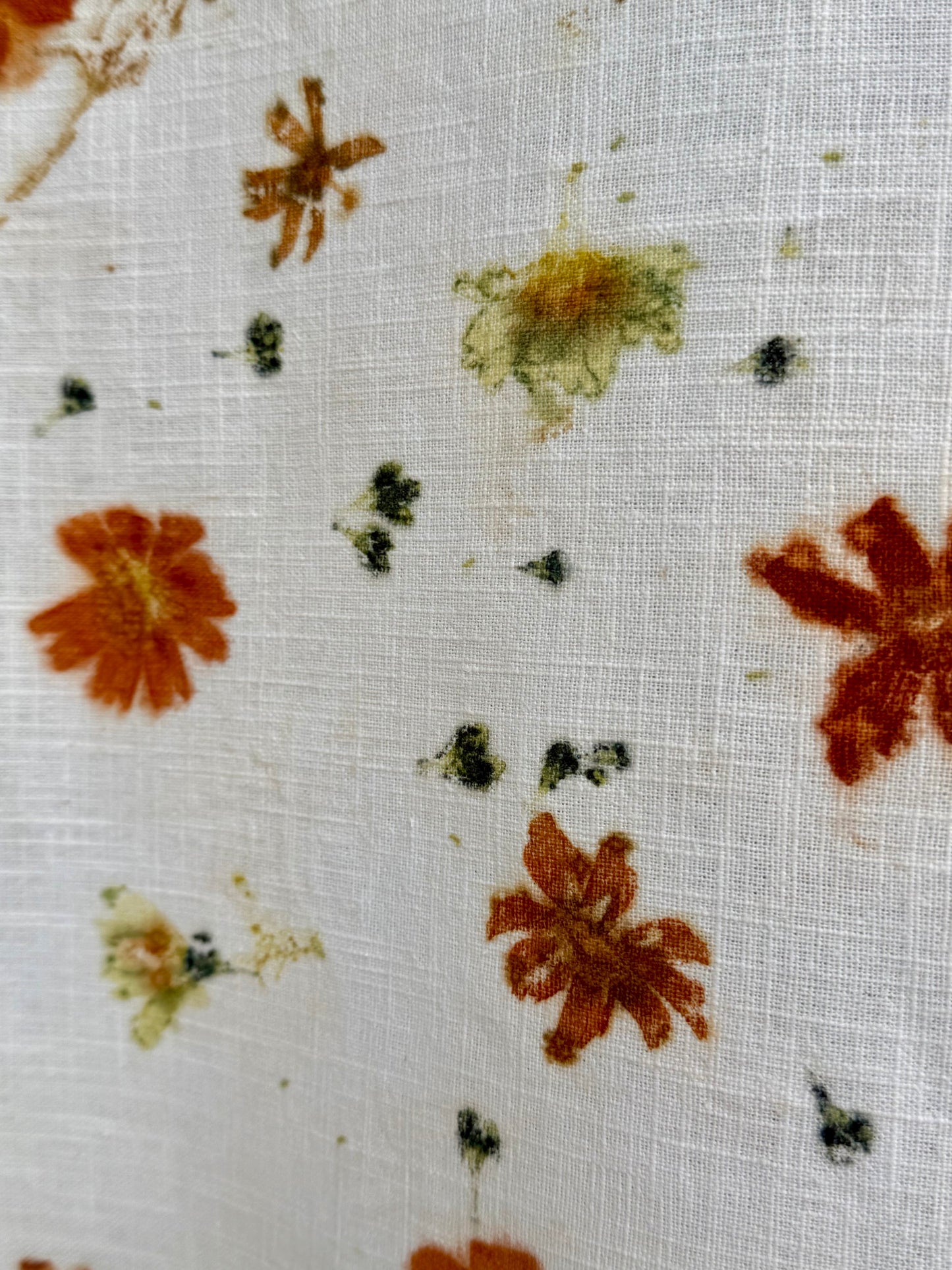 eco-printed linen fabric - close-up of a scabiosa, coreopsis and cosmos flower print