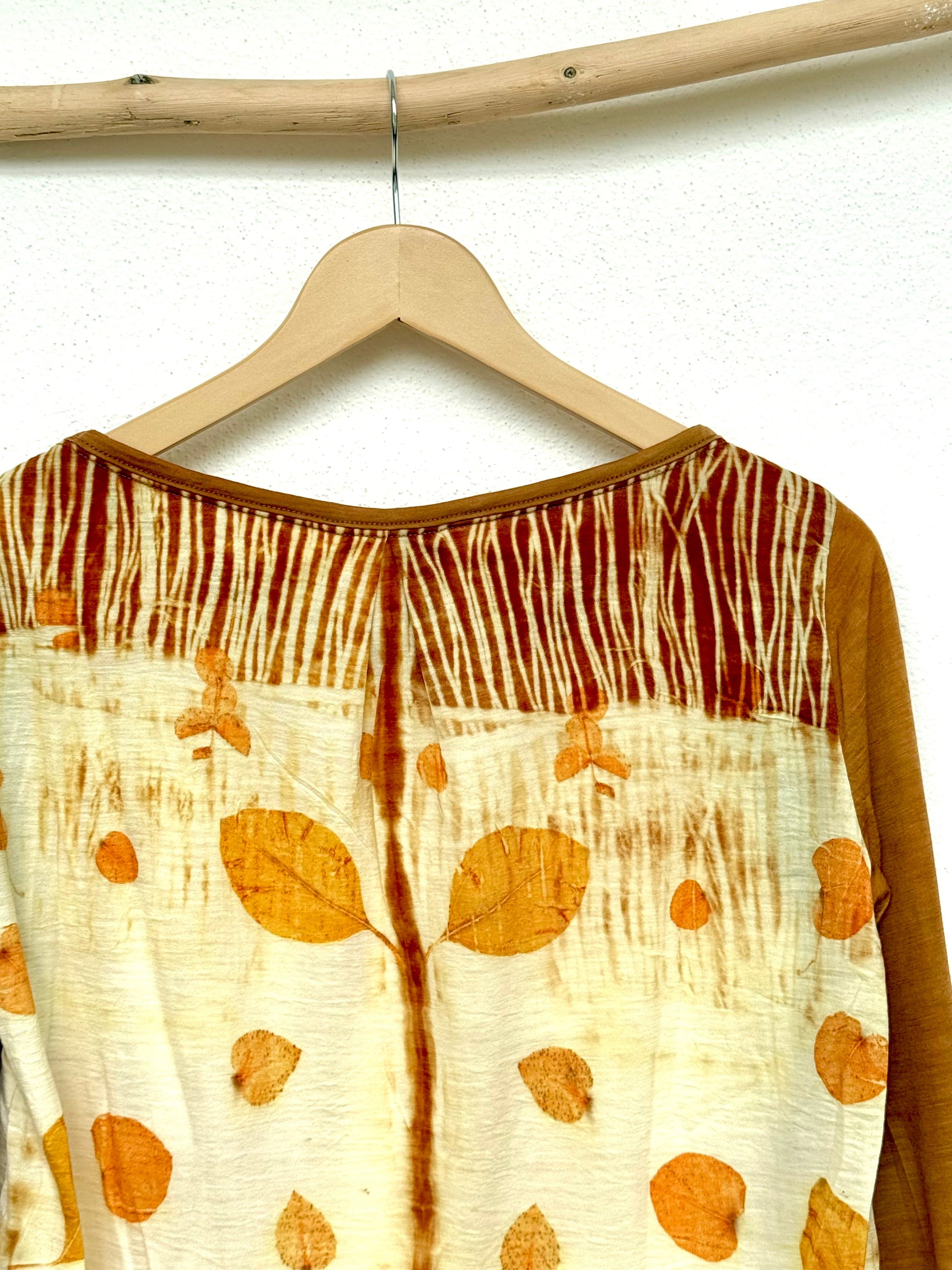 tie marks on the back of a naturally dyed top with eucalyptus