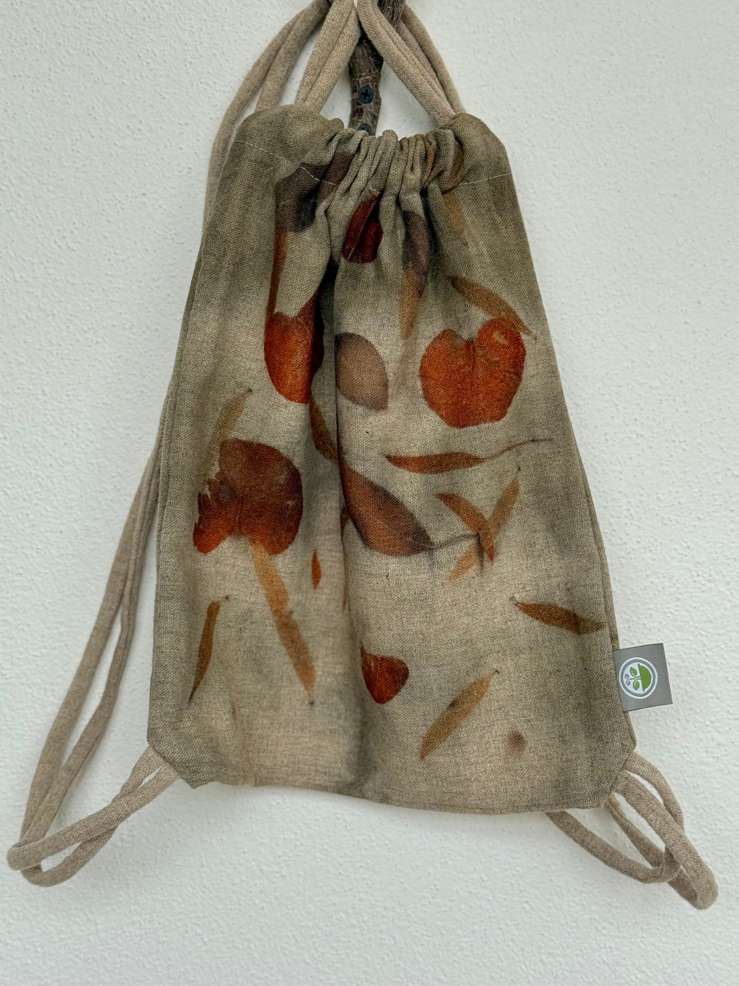 front of a woolen bag ith eucalyptus leaves eco-printed and brand logo by DOT 'N' POT 