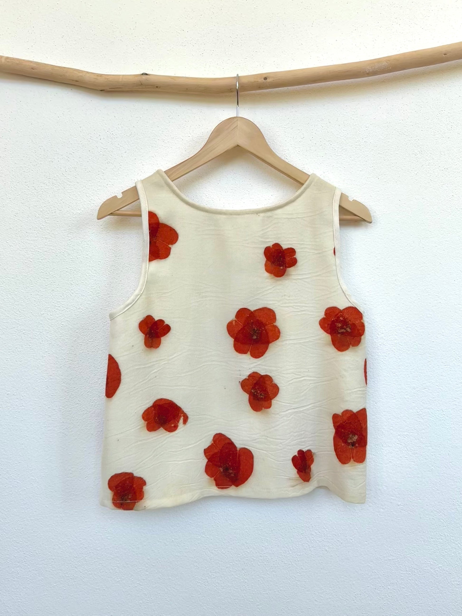 Beige merino wool tank top with red floral, eco-printed poppy pattern made with eucalyptus leaves by DOT 'N' POT - back view