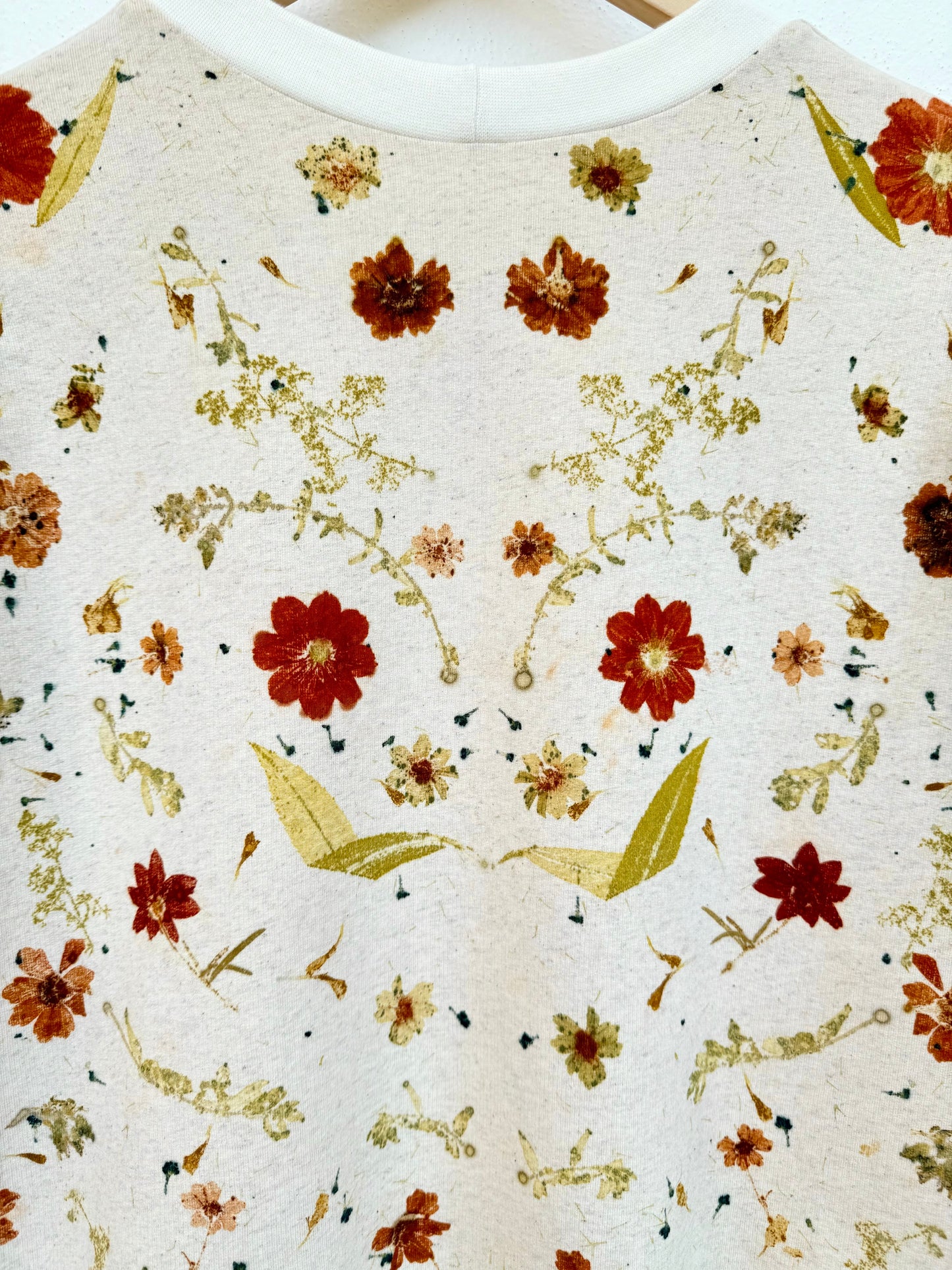 back part of an eco-printed sweater - close-up on the flower prints by DOT 'N' POT