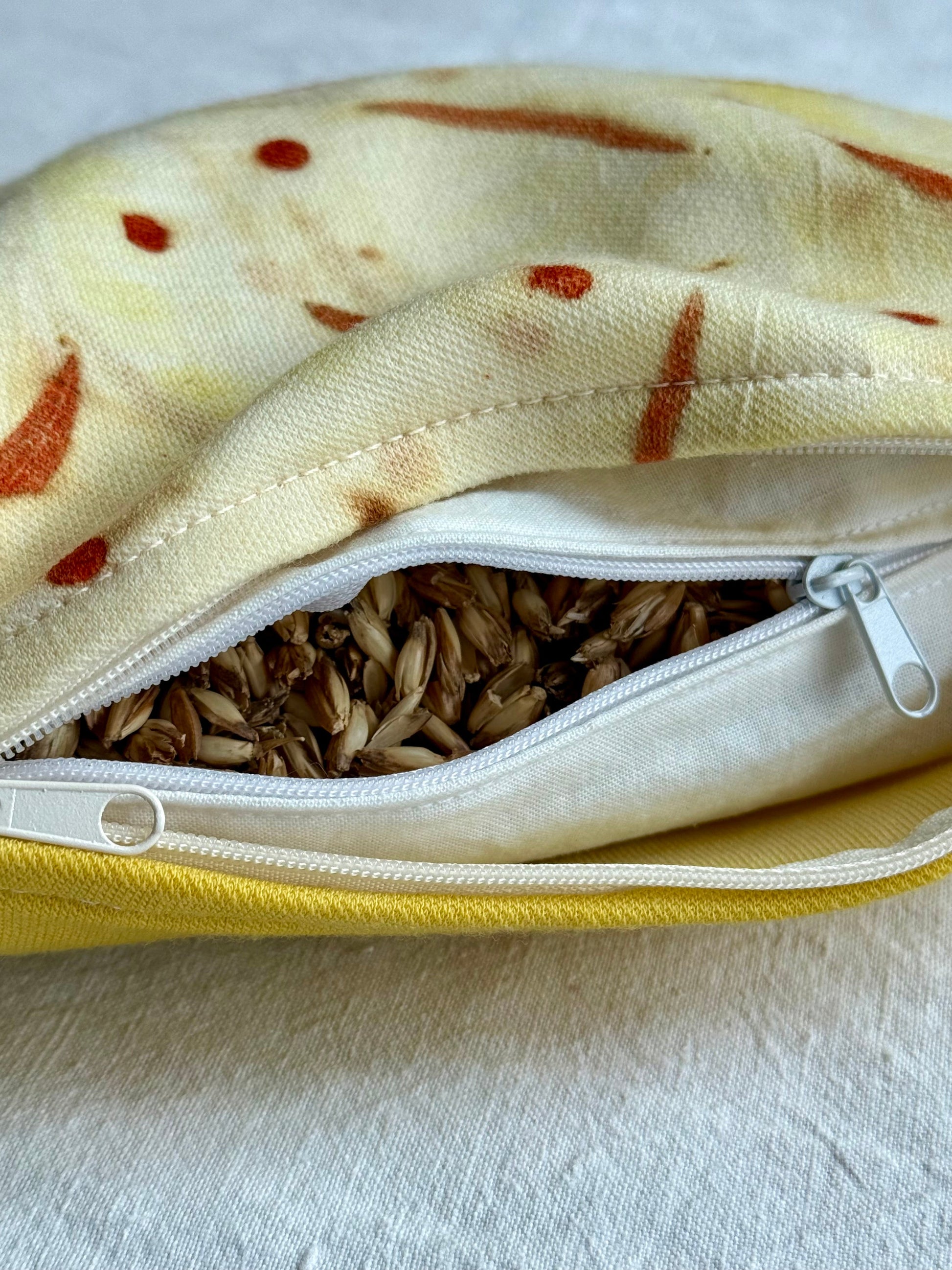Herbal pillow close-up with spelt husks filling and ecalyptus eco-print