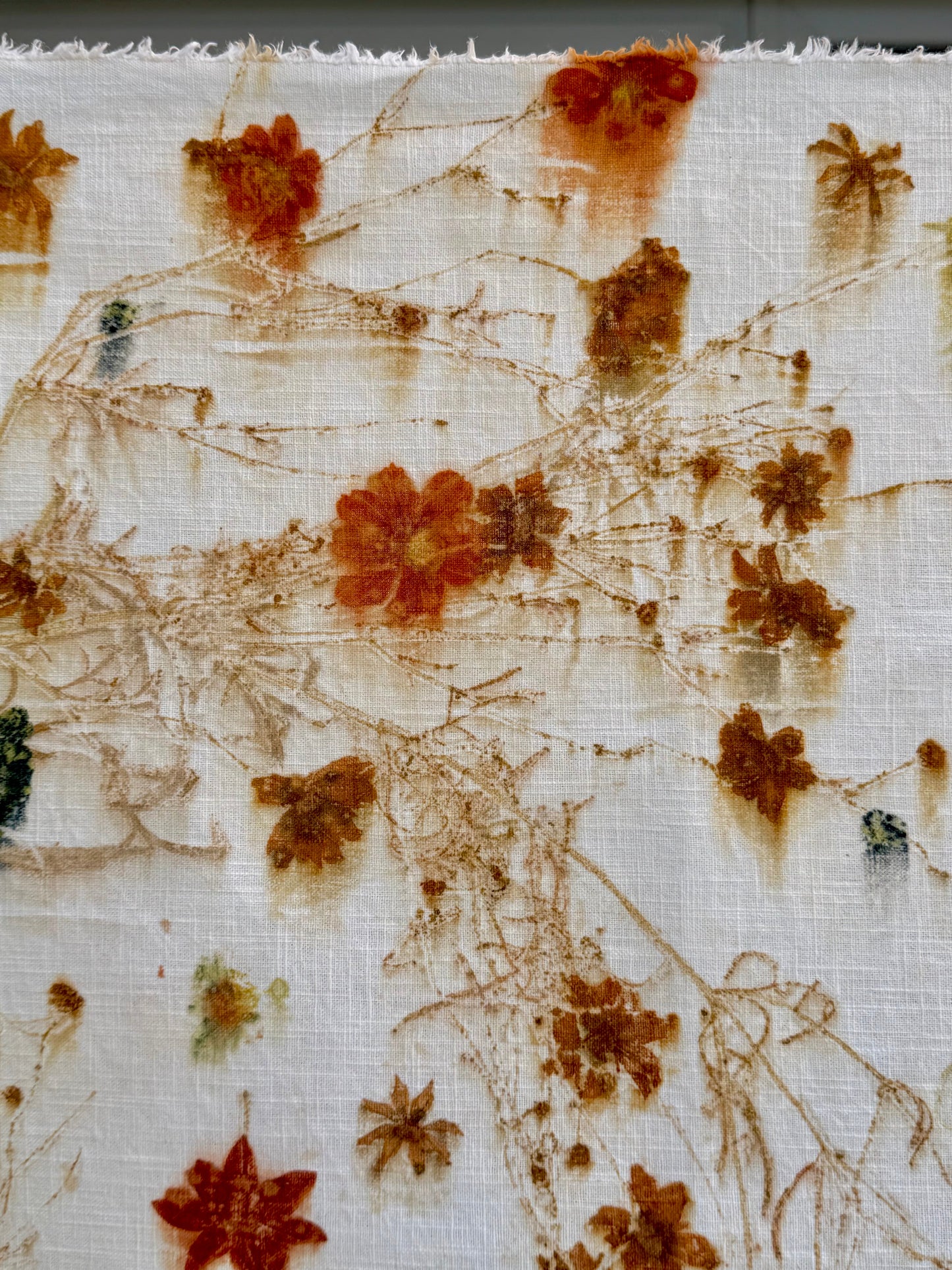 eco-printed linen fabric - close-up of the bleeded print