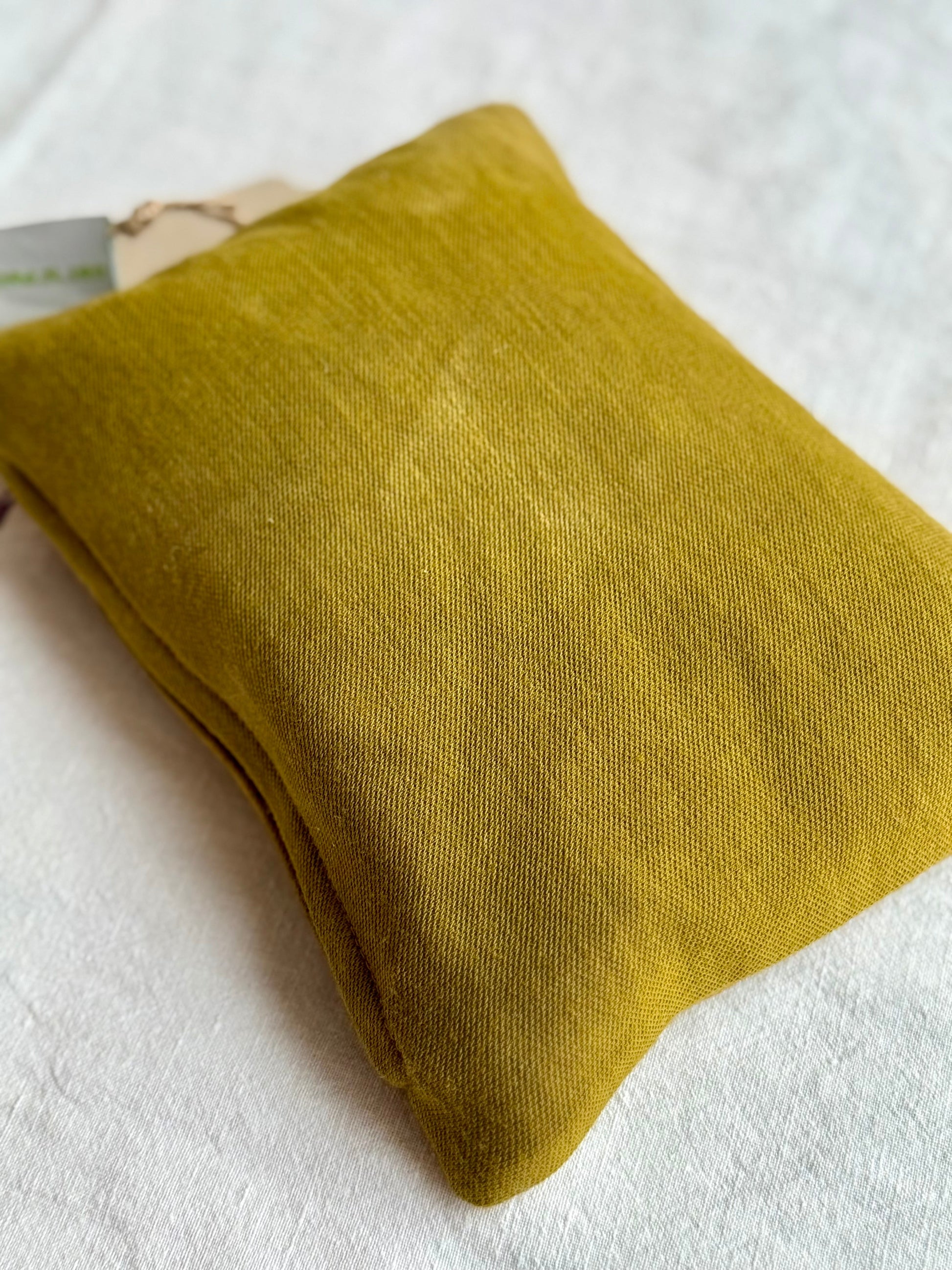 Back of a pillow dyed with red onion skins 