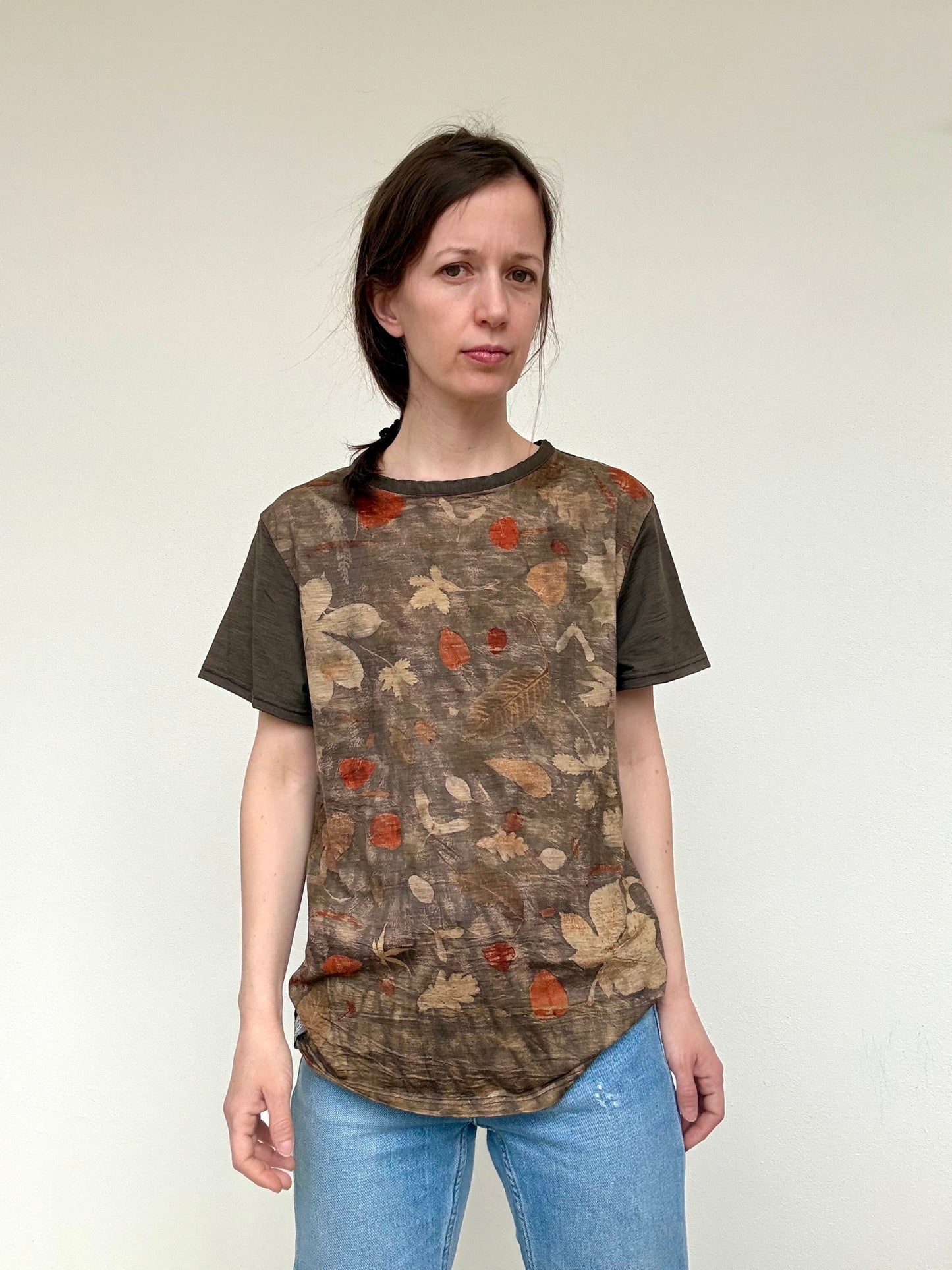 Woman wearing an eco-printed t-shirt printed and naturally dyed with plants by DOT 'N' POT 