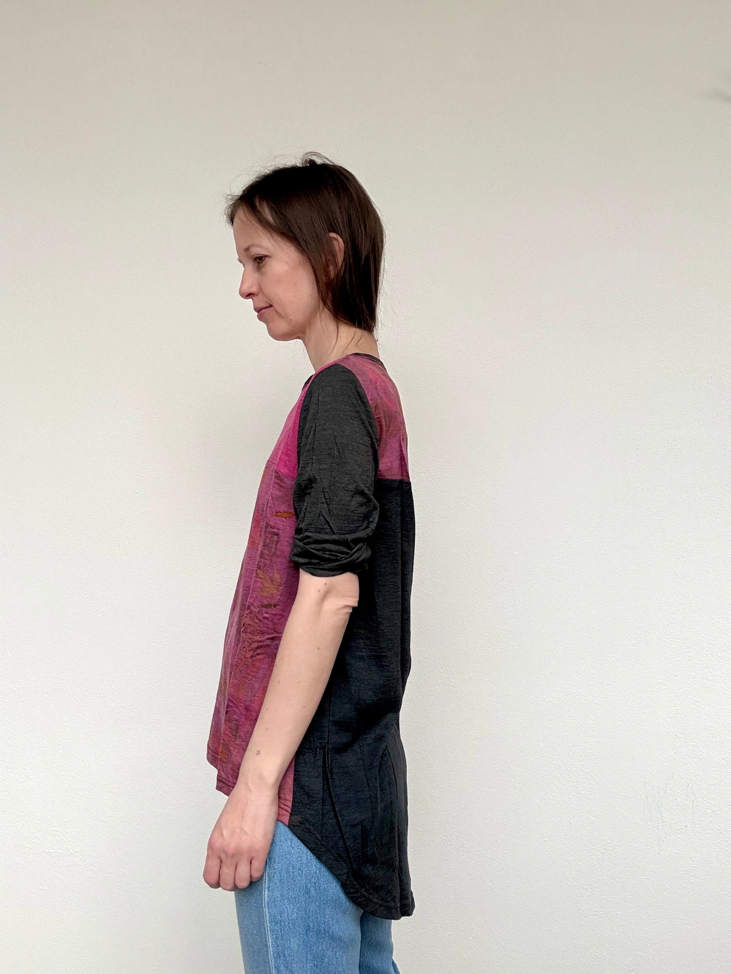 woman wearing a dark gray merino wool top, naturally dyed wit cochineal and logwood chips