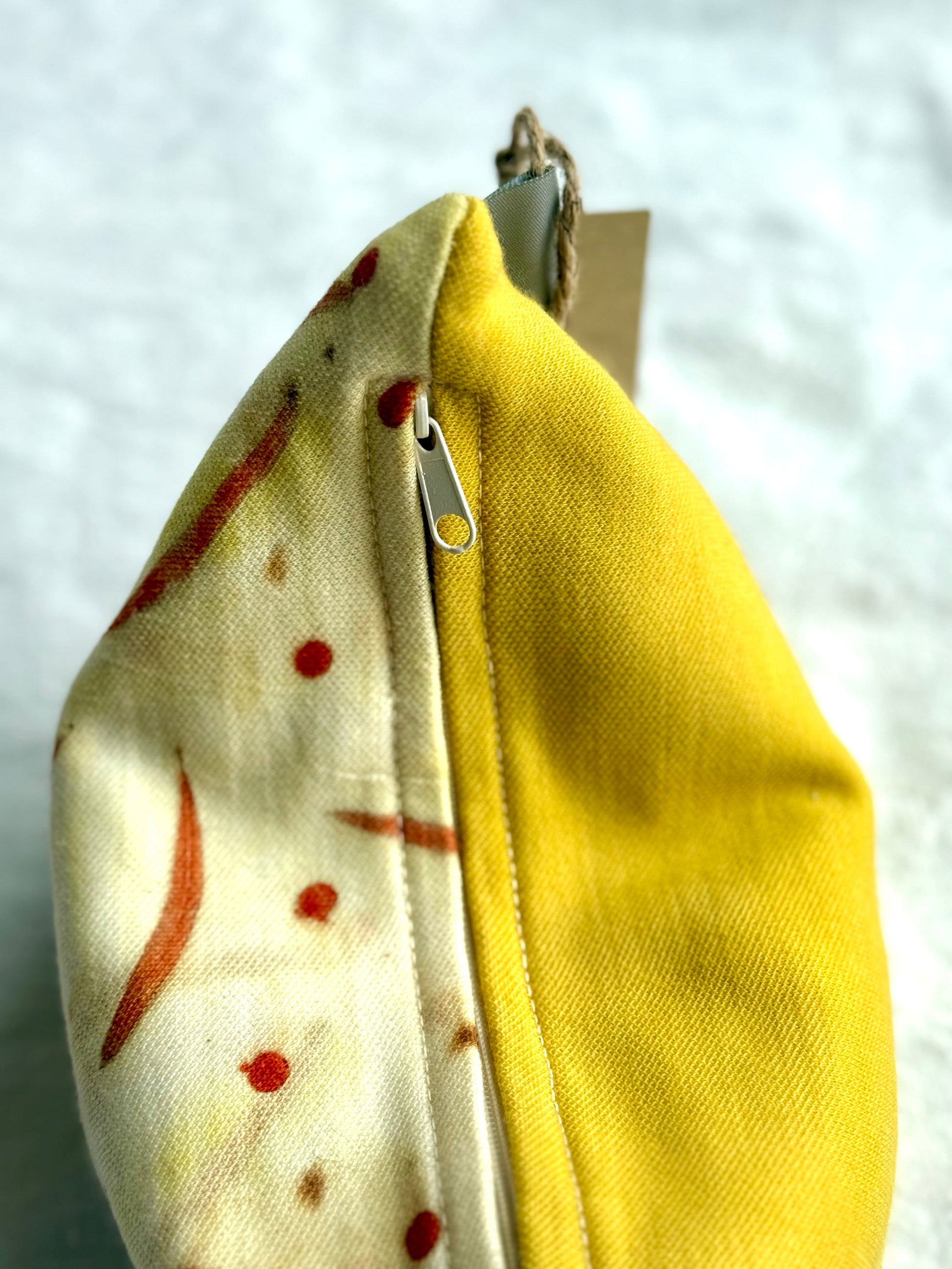 Herbal pillow zipper detail, naturally dyed with weld