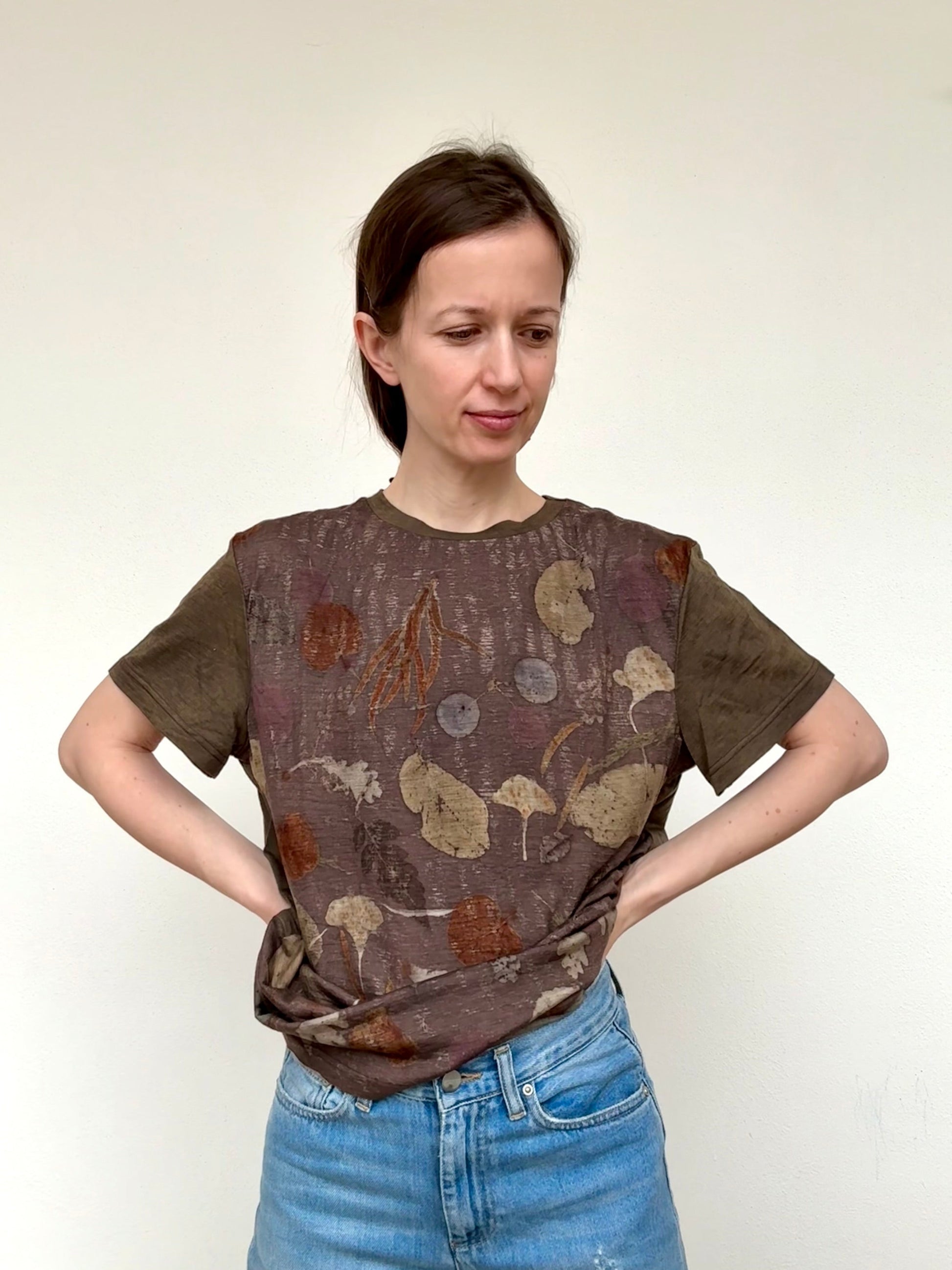 women wearing a naturally dyed merino wool t-shirt eco-printed with various leaves by DOT 'N' POT