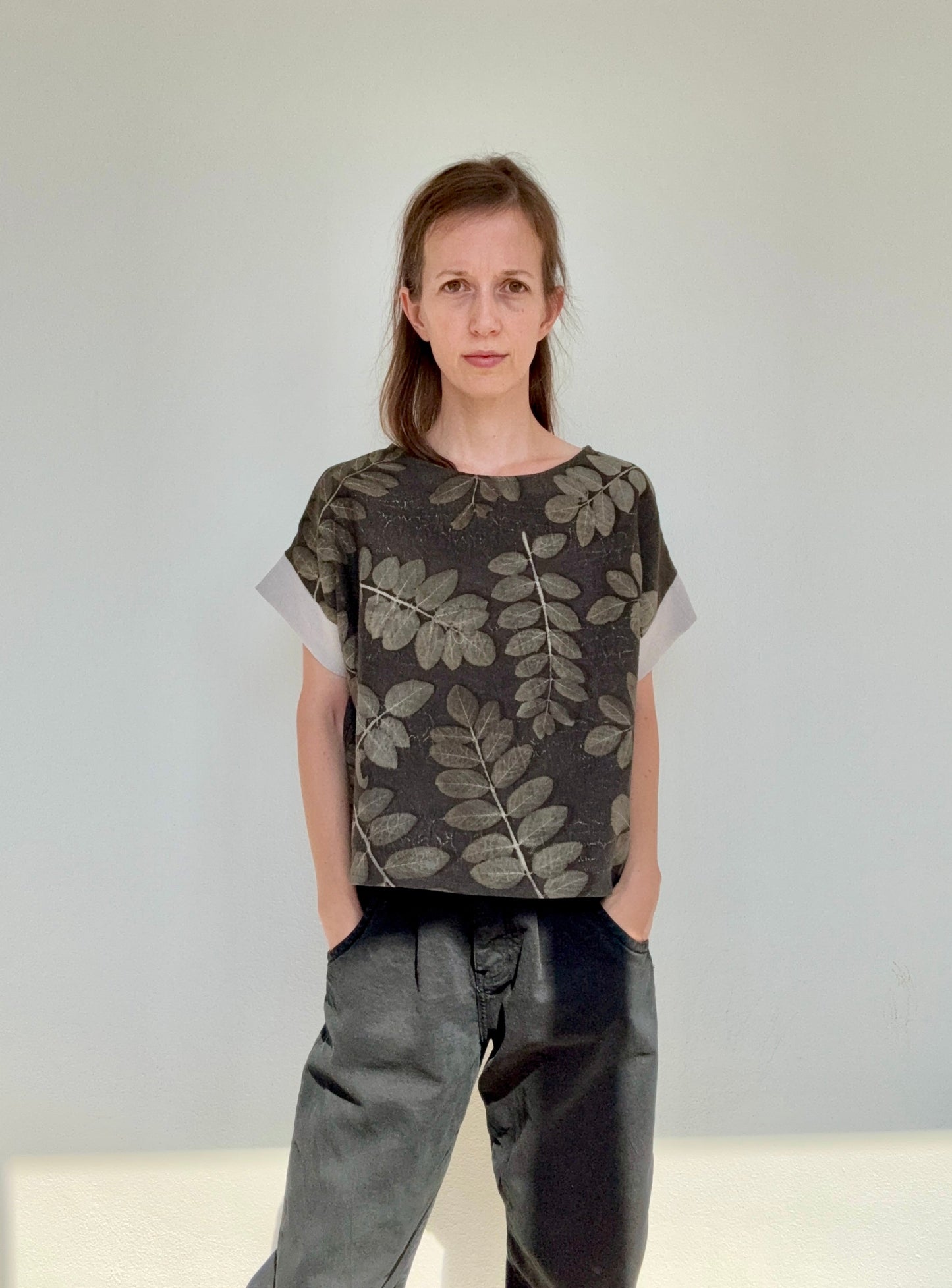 women wearing an eco-printed robinia leaves linen top by DOT 'N' POT