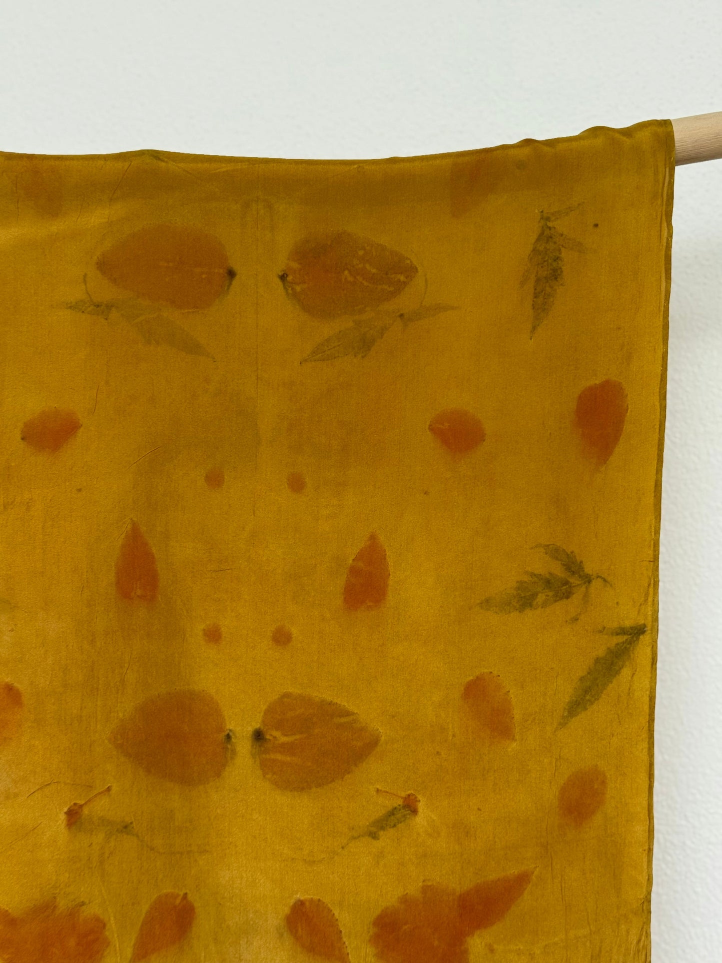 silk scarf naturally dyed with onion skins and eco-printed with eucalyptus leaves - detail of the pattern