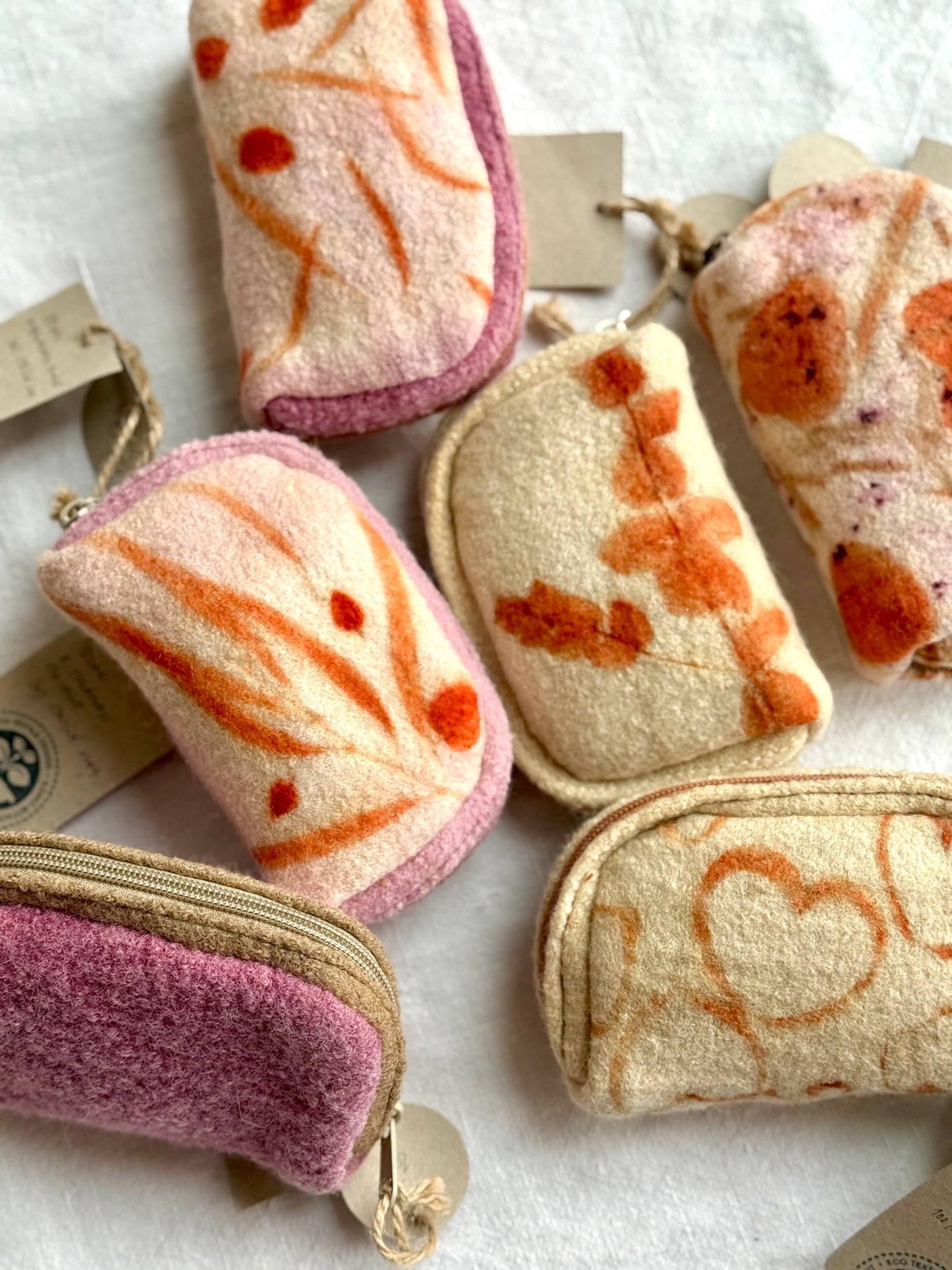 eco-printed and naturally dyed woolen purses with tags and zippers 