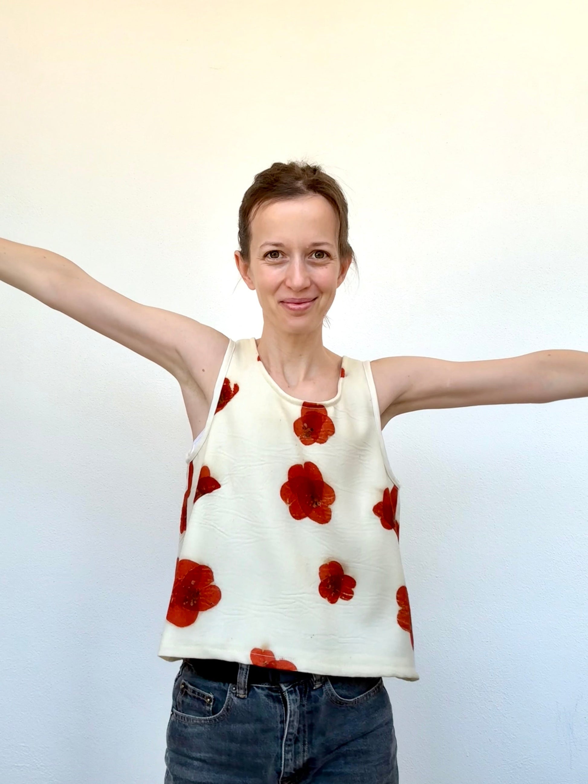 Woman wearing an eco-printed merino wool top by DOT 'N' POT