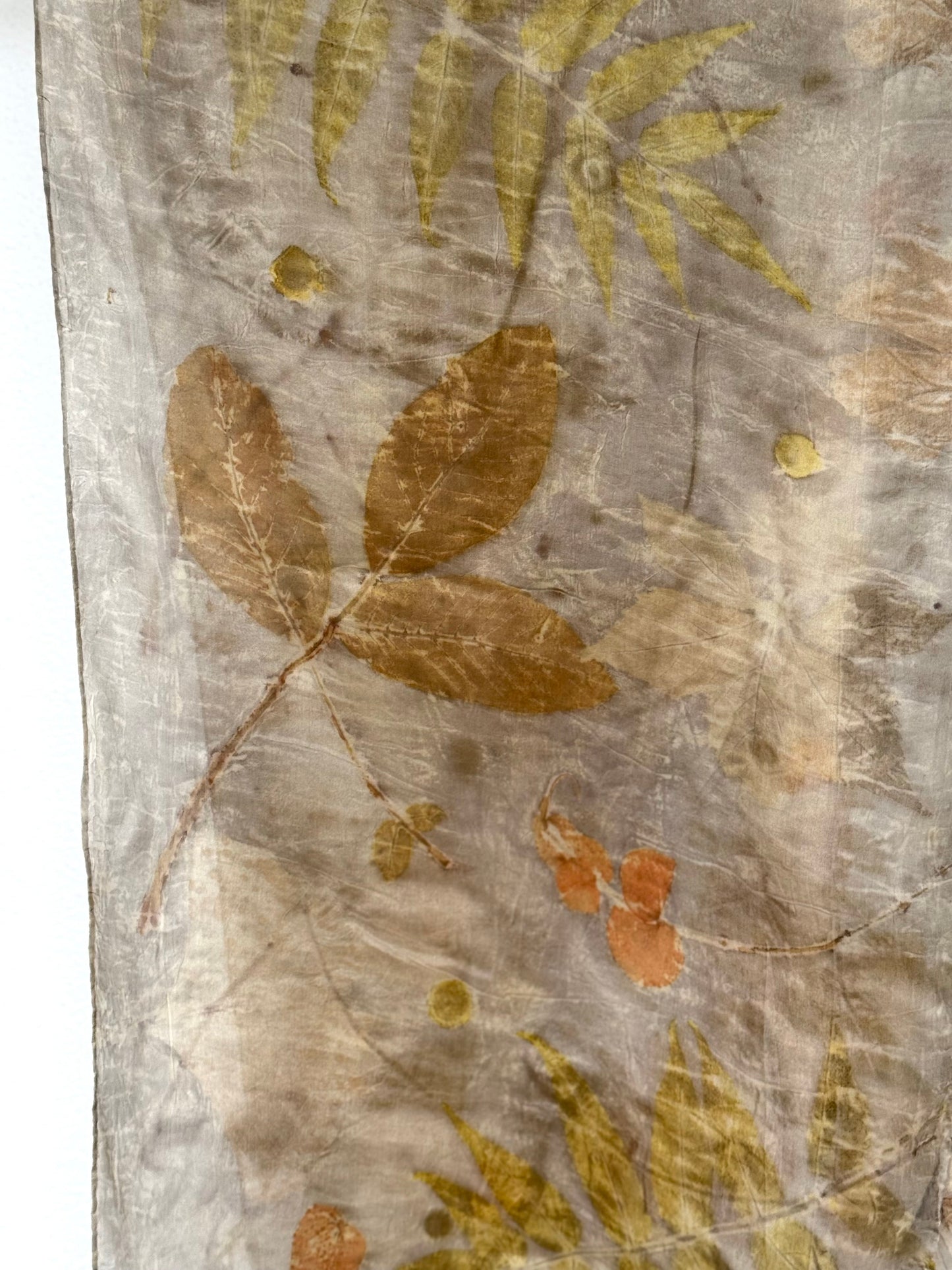 sumac and walnut close- up on a naturally dyed silk scarf