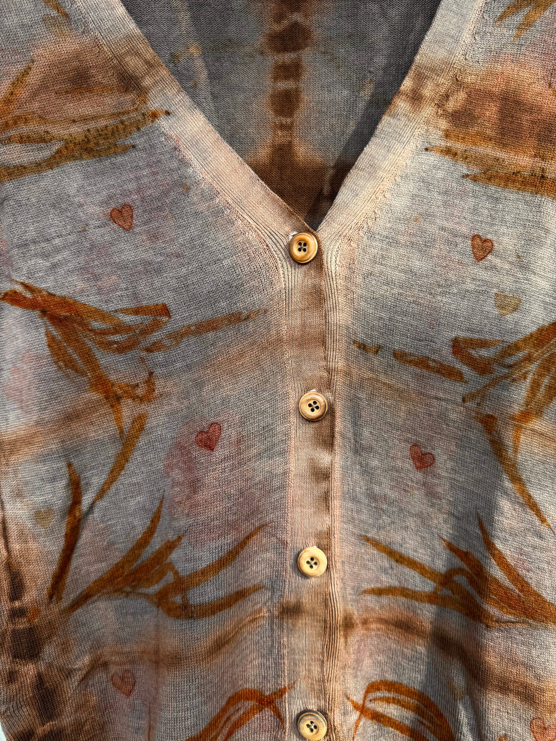 Sweater naturally dyed with cutch and walnut husks, eco-printed with eucalyptus leaves and wooden buttons - close-up