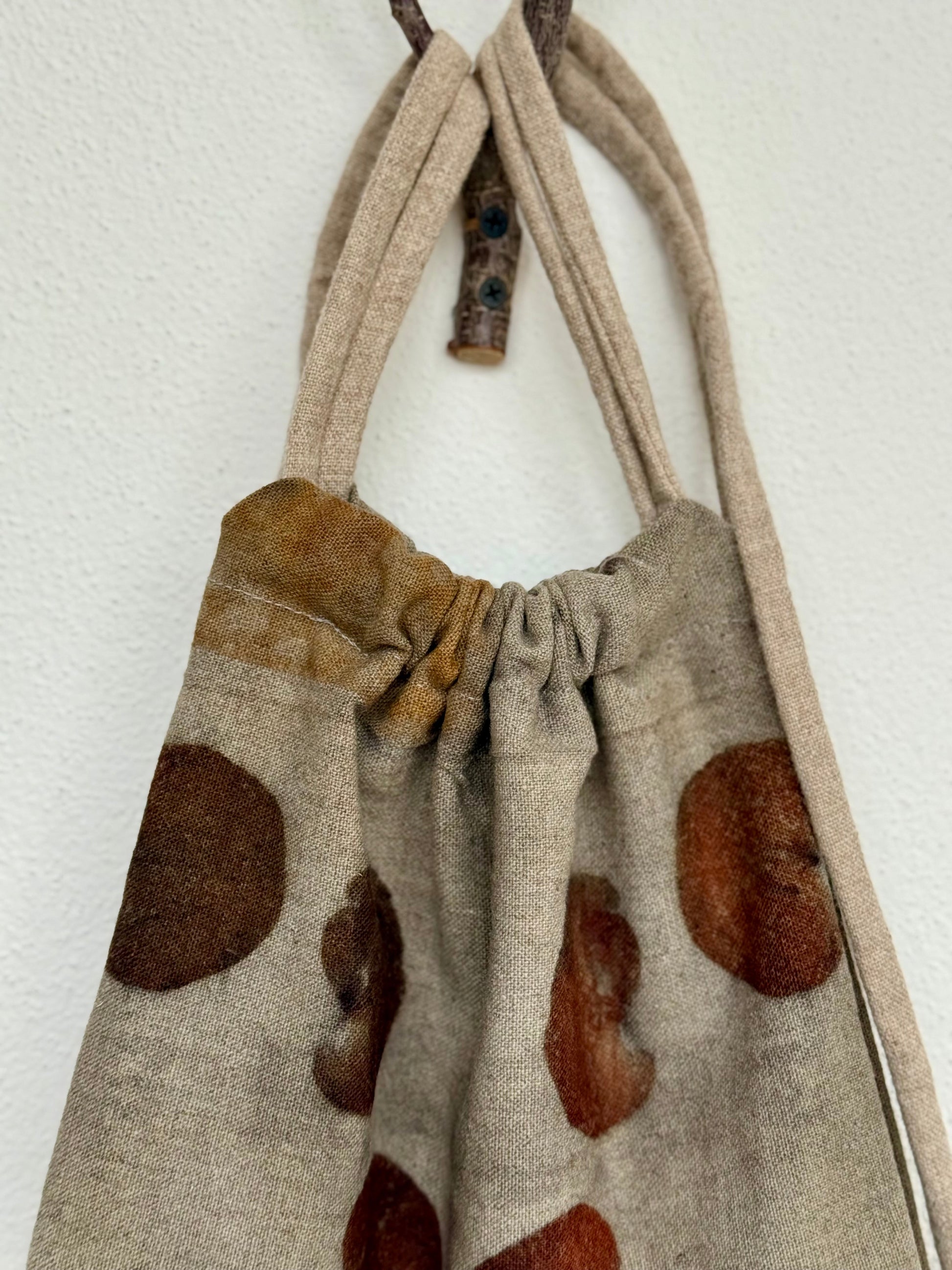 cloes-up of a woolen naturally dyed drawstring bag