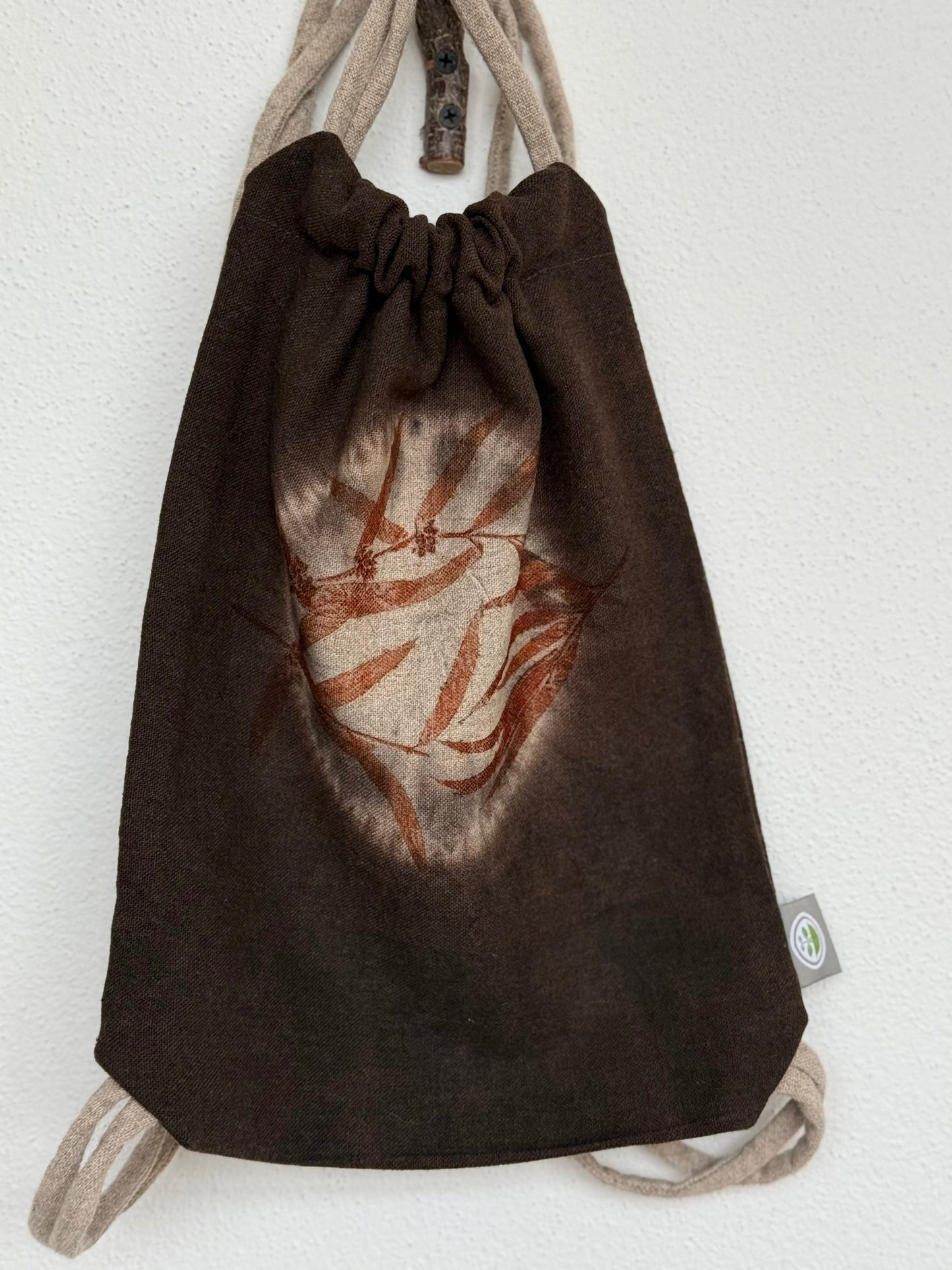 front part of a shibori dyed woolen drawstring bag with eucalyptus eco-print 