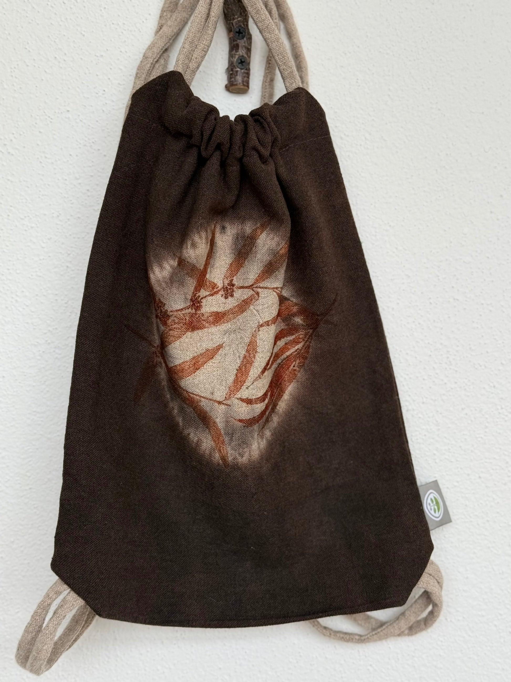front part of a shibori dyed woolen drawstring bag with eucalyptus eco-print 
