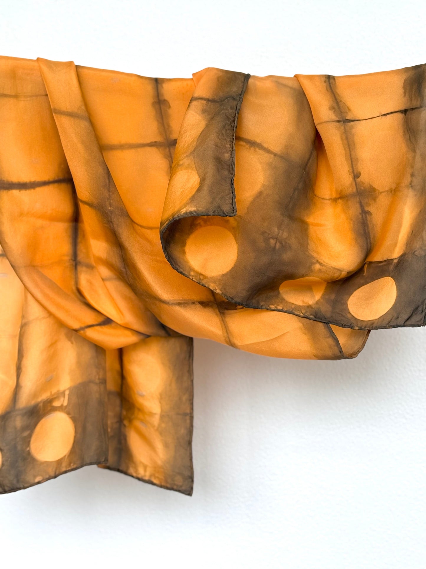 Annatto and sweet chestnut dyed silk scarf with folded shibori pattern by DOT 'N' POT