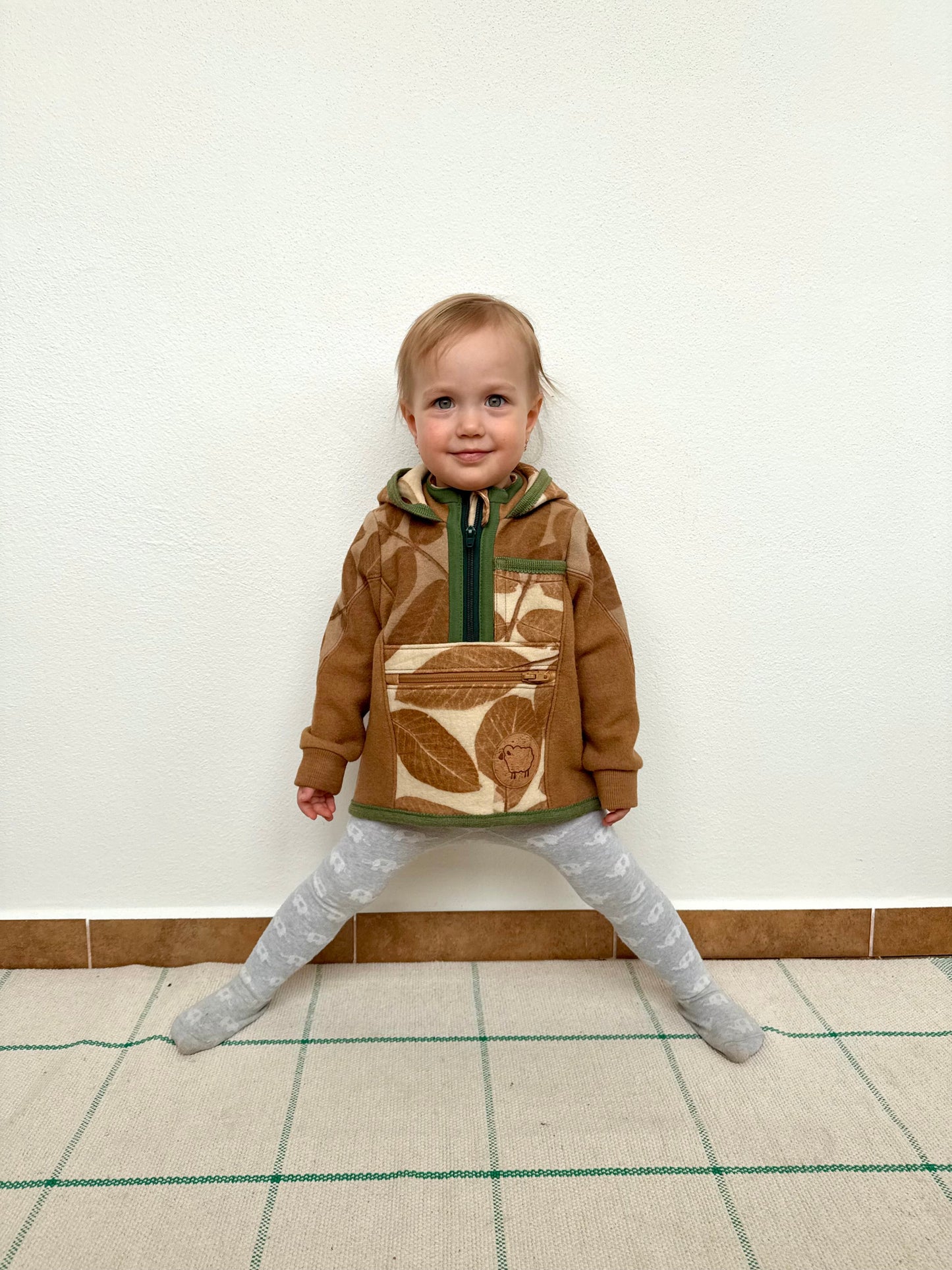 Child wearing merino wool sweater by DOT 'N' POT - naturally dyed brown with walnut husks