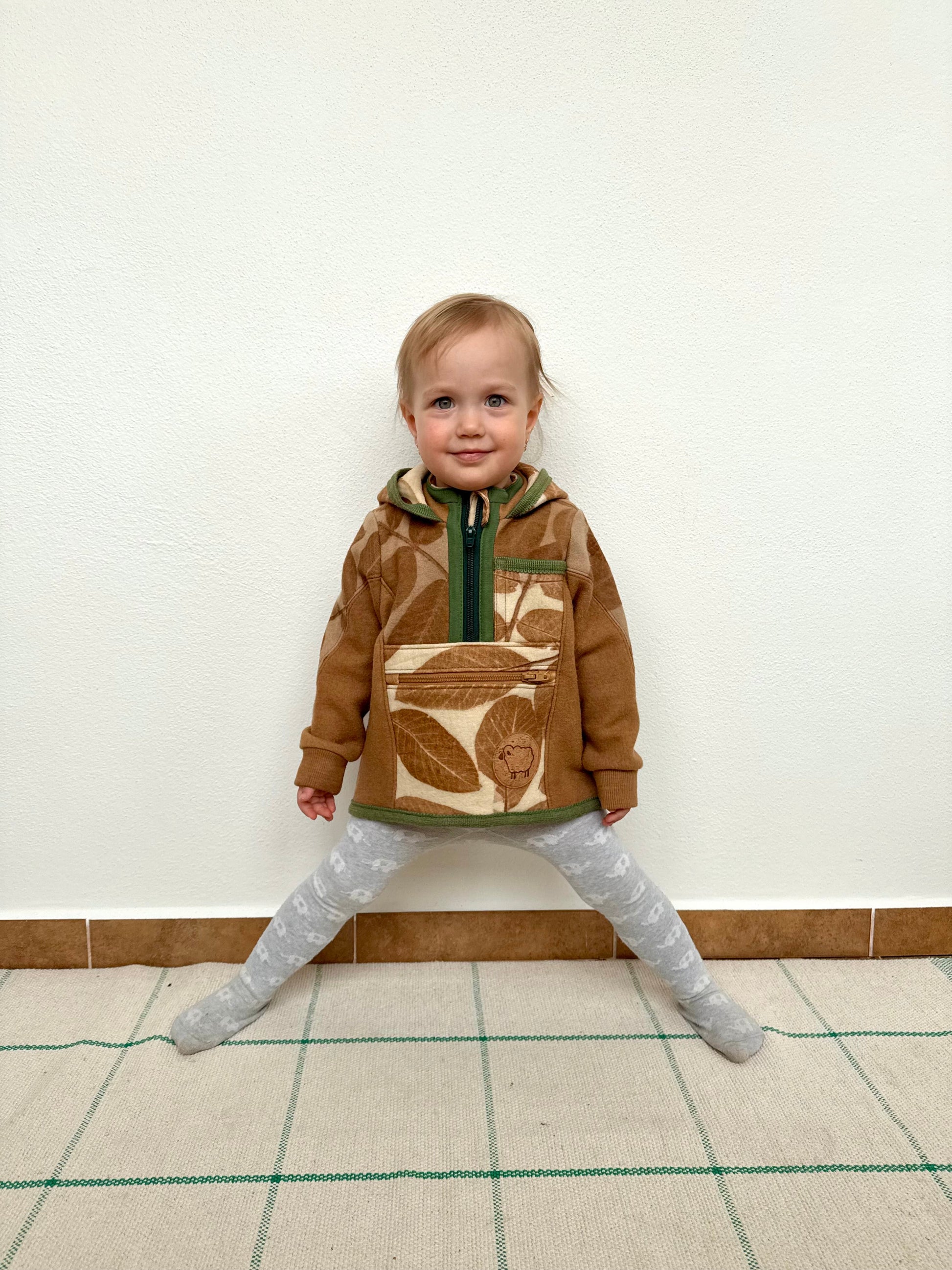 Child wearing merino wool sweater by DOT 'N' POT - naturally dyed brown with walnut husks