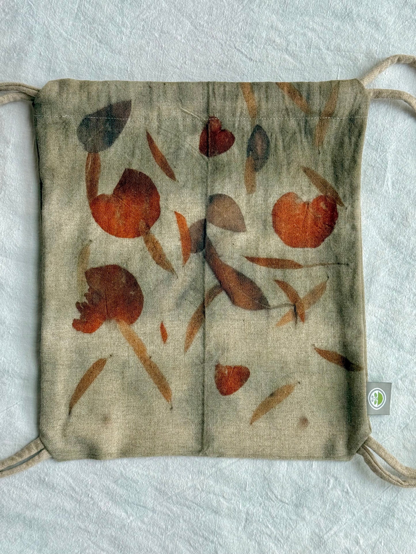 front of an eco-printed woolen bag by DOT 'N' POT - naturally gray colored