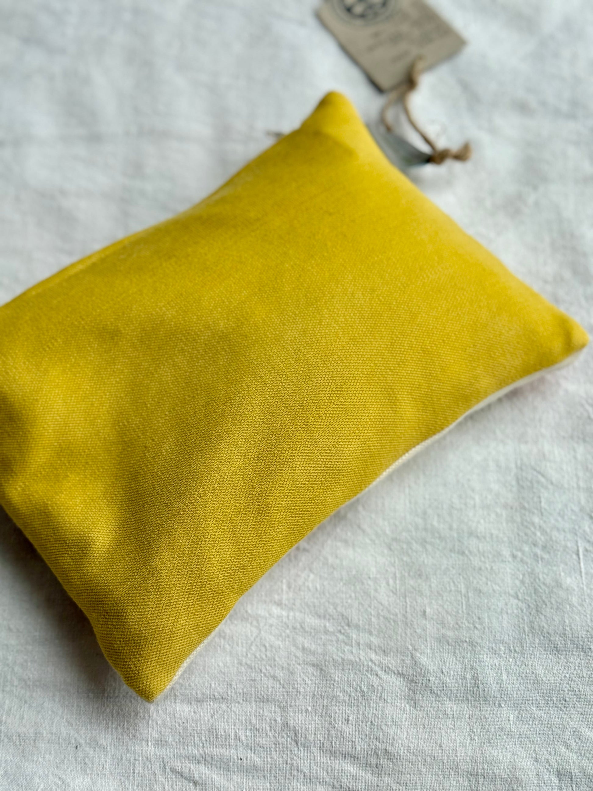 Yellow back of a herbal pillow naturally dyed with Weld