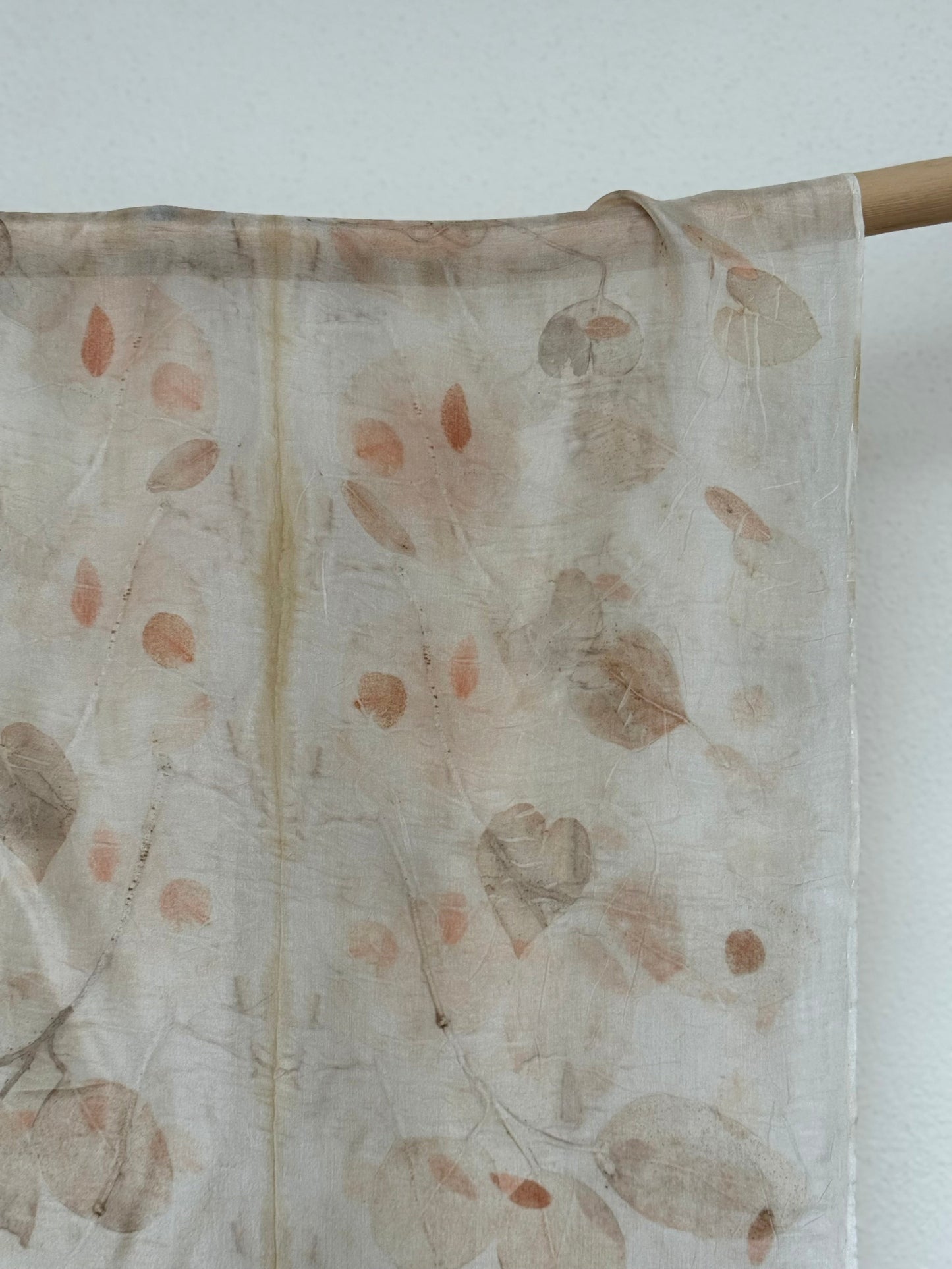 silk scarf with natural eco-print made with eucalyptus leaves hanging