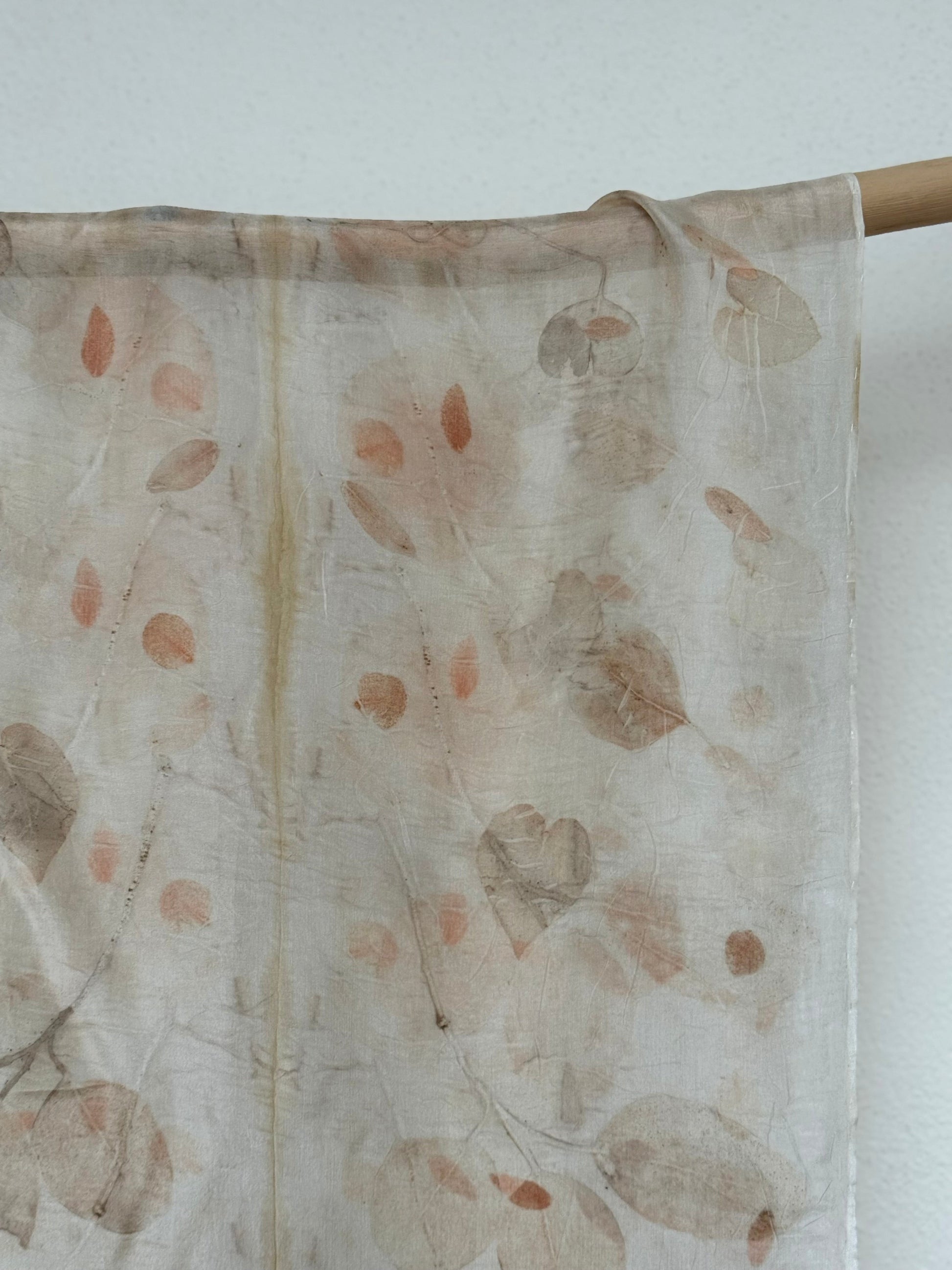 silk scarf with natural eco-print made with eucalyptus leaves hanging
