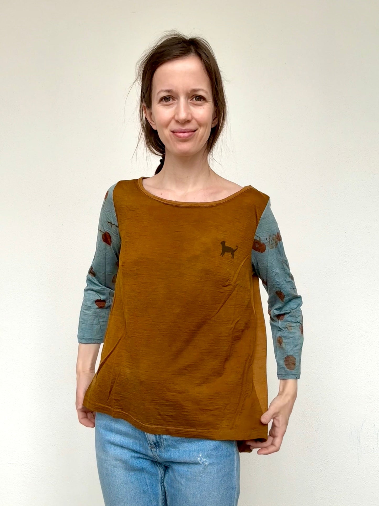Woman wearing a brown naturally dyed merino top with eco-printed details by DOT 'N' POT